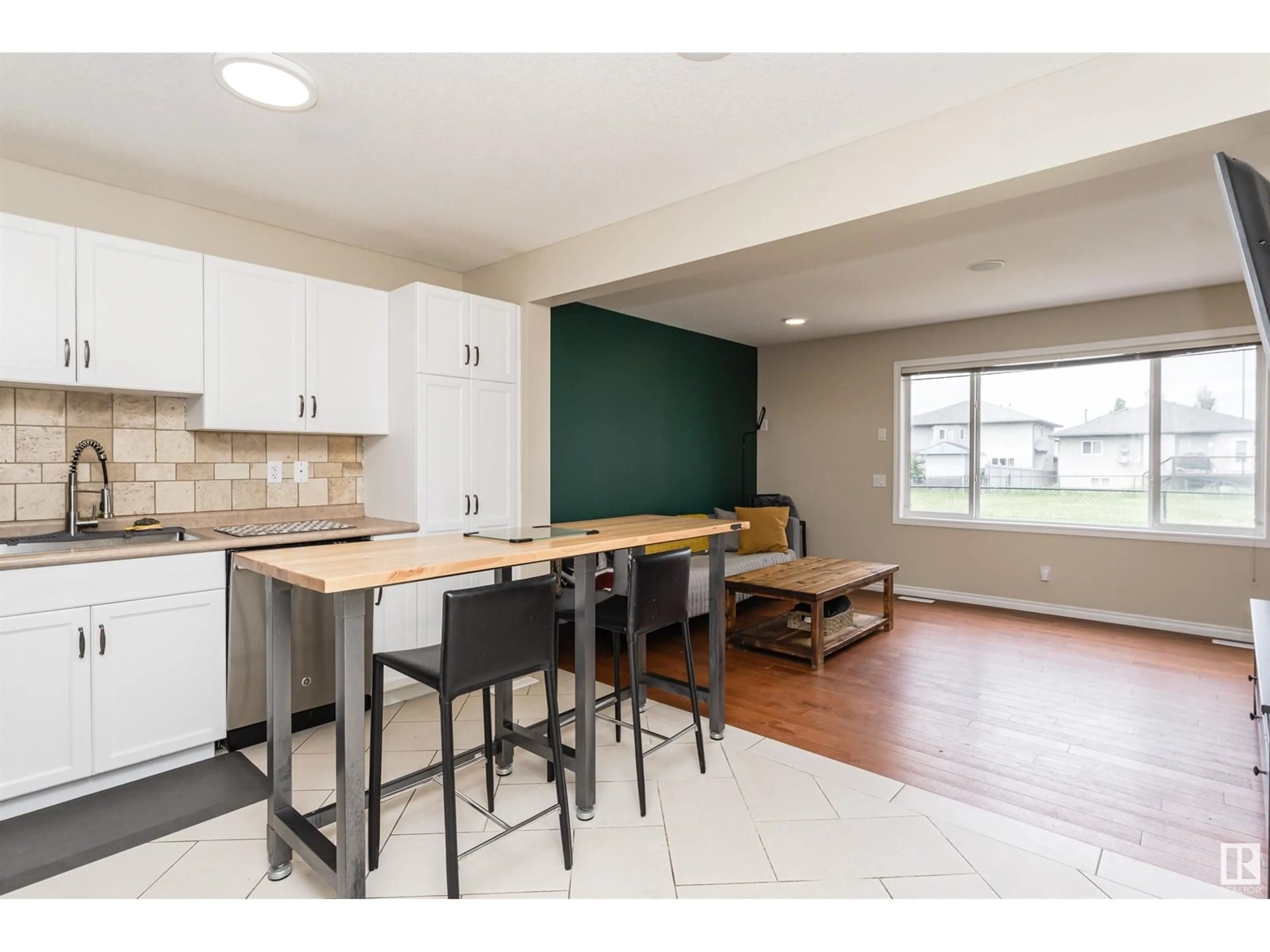 Open concept kitchen, wood/laminate floor for #31 - 2816 34 AV, Edmonton Alberta T6T2B4