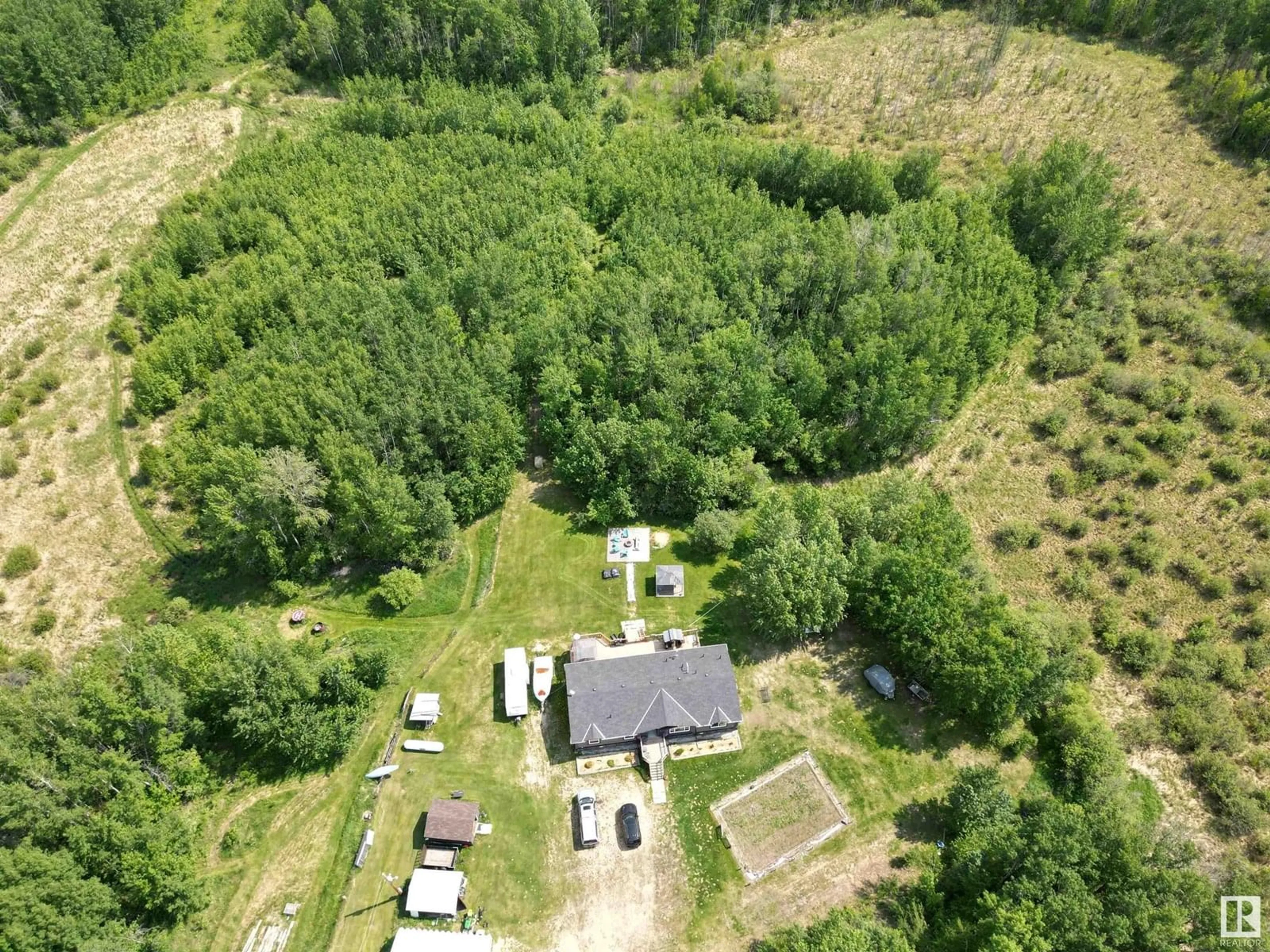 A pic from outside/outdoor area/front of a property/back of a property/a pic from drone, forest/trees view for 55227 RGE ROAD 33, Rural Lac Ste. Anne County Alberta T0E1A0