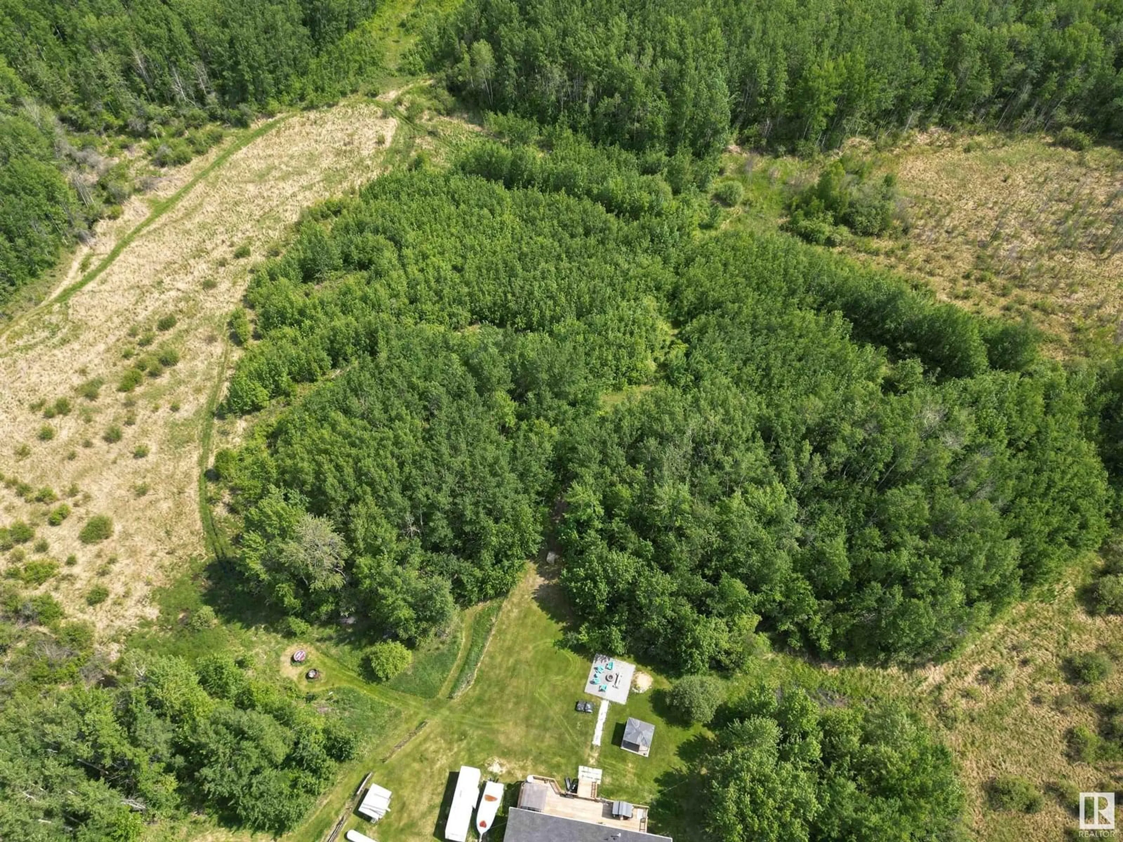 A pic from outside/outdoor area/front of a property/back of a property/a pic from drone, forest/trees view for 55227 RGE ROAD 33, Rural Lac Ste. Anne County Alberta T0E1A0
