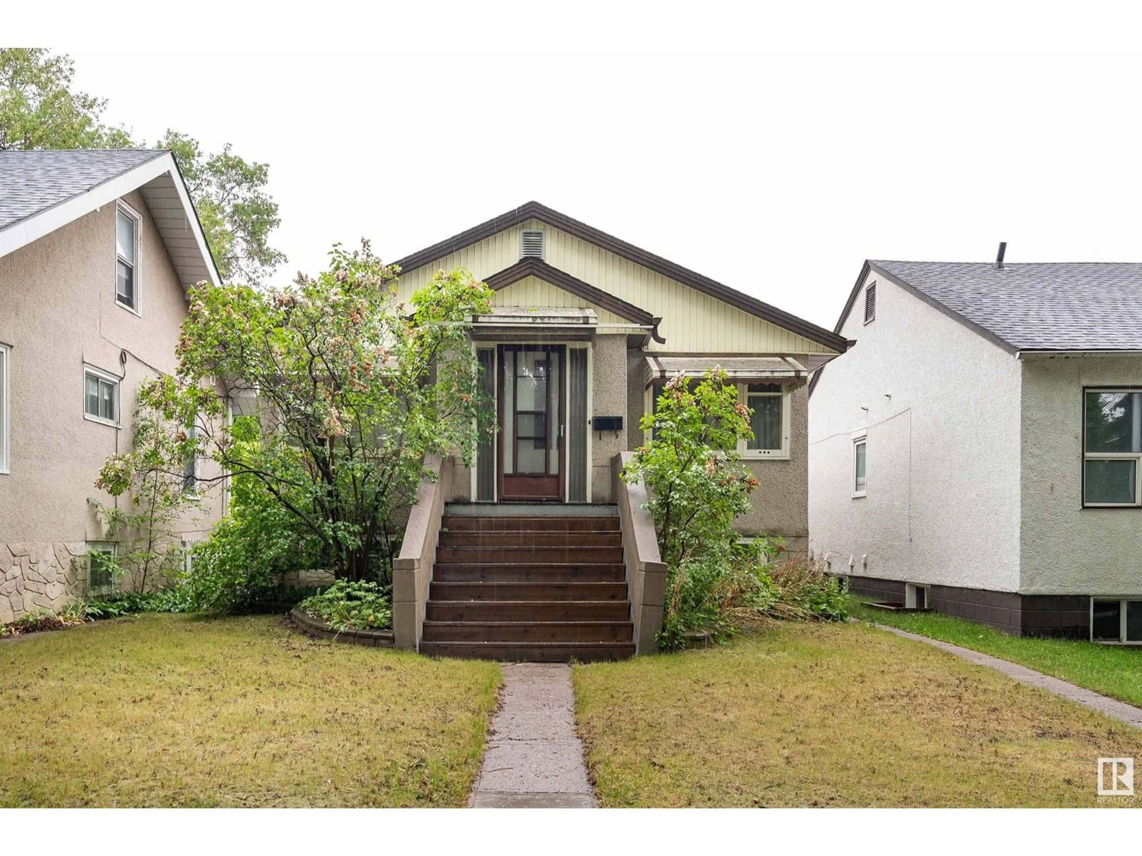 Home with vinyl exterior material, street for NW - 11245 69 ST, Edmonton Alberta T5B1R6