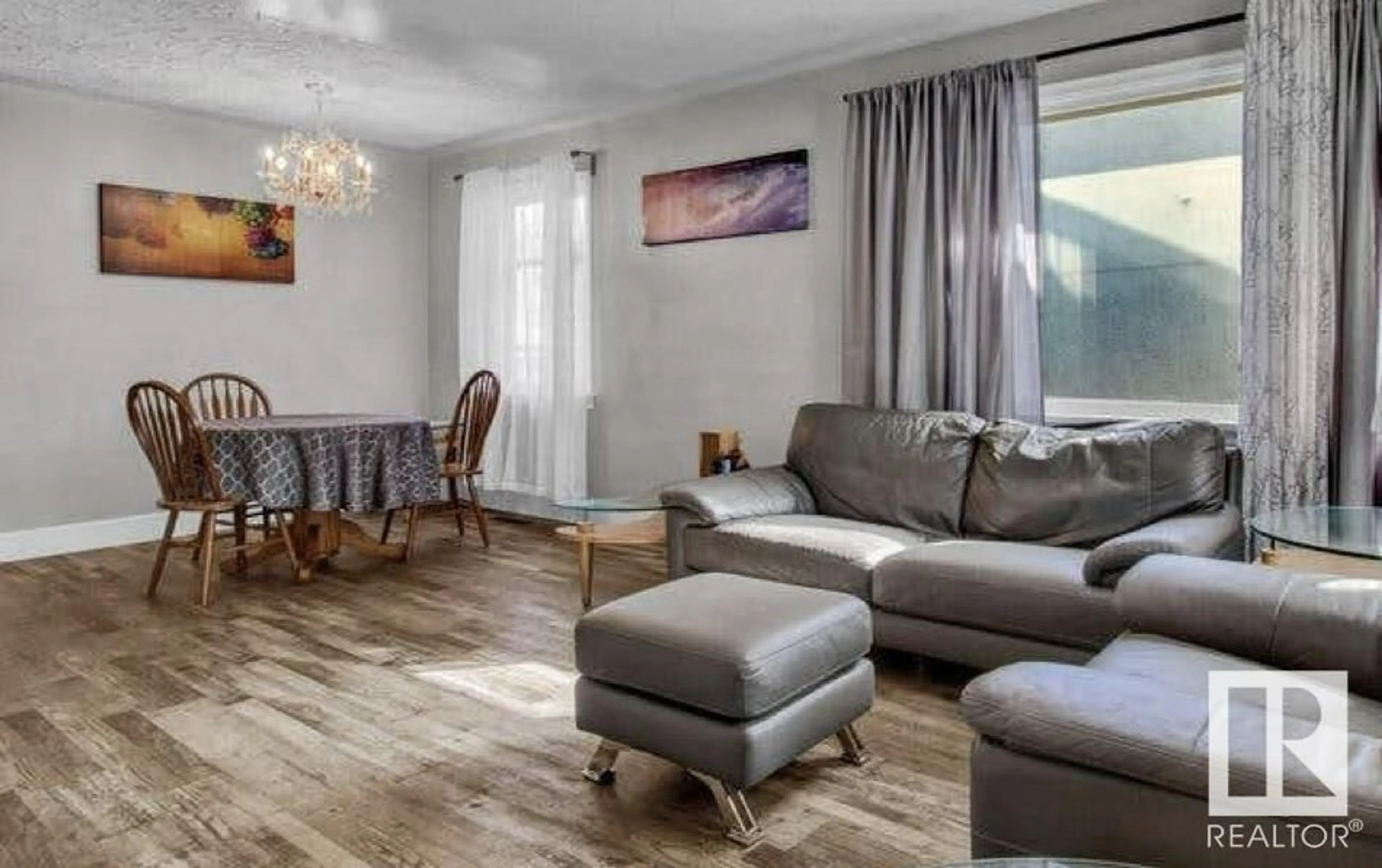 Living room with furniture, wood/laminate floor for NW - 11245 69 ST, Edmonton Alberta T5B1R6