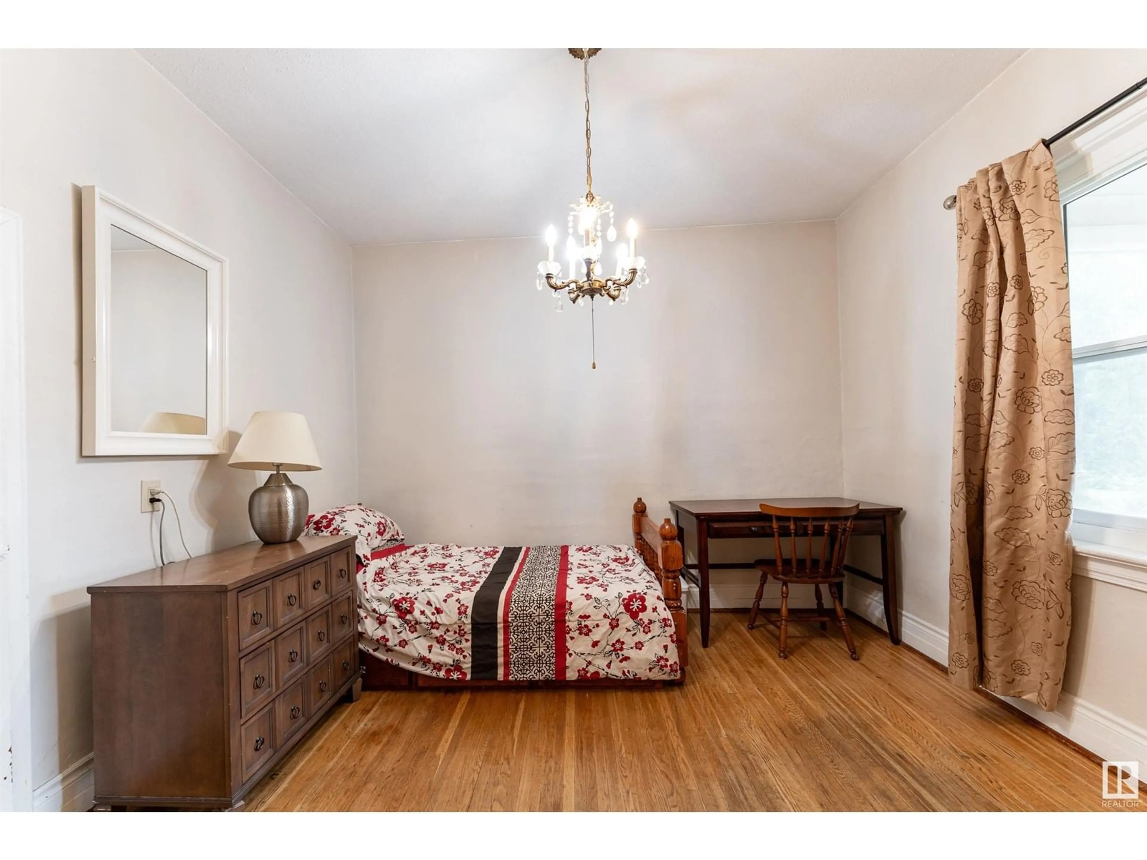 Bedroom with bed, wood/laminate floor for NW - 11406 66 ST, Edmonton Alberta T5B1H8