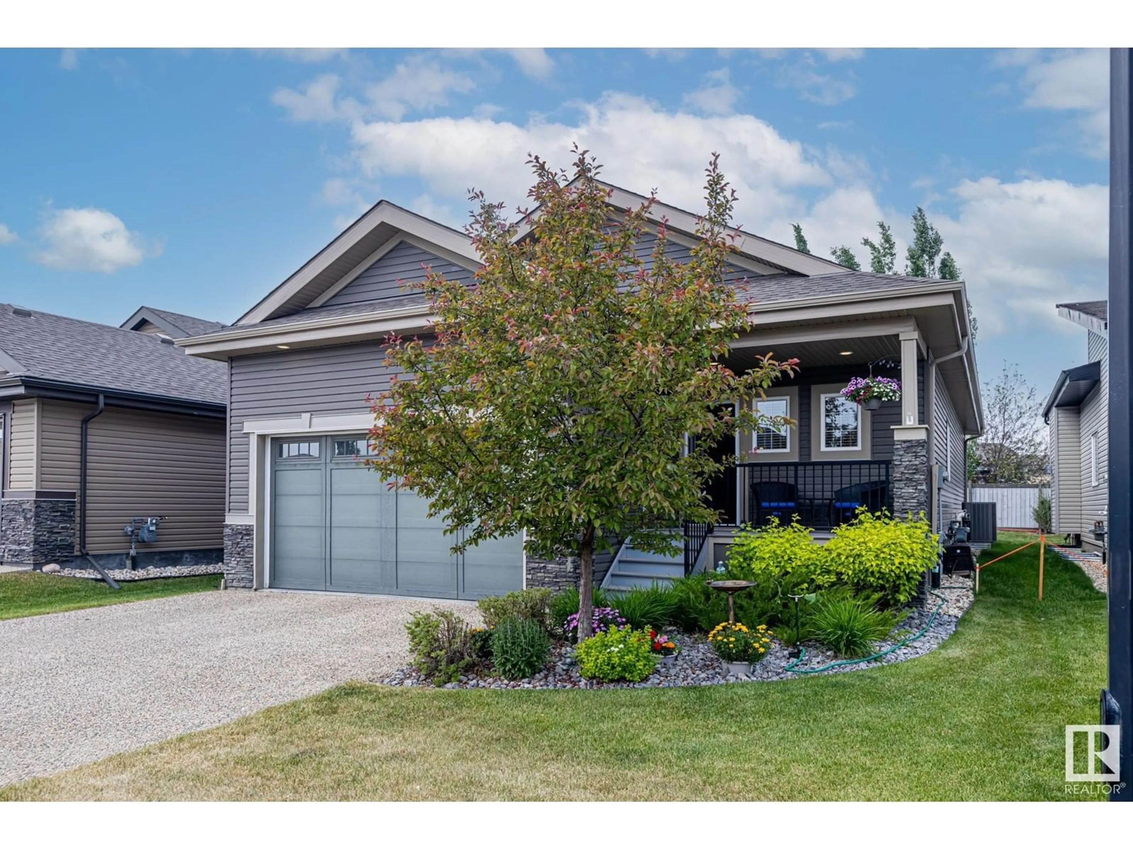 Home with vinyl exterior material, street for 50 - 132 HEATHERGLEN DR, Spruce Grove Alberta T7X0R6