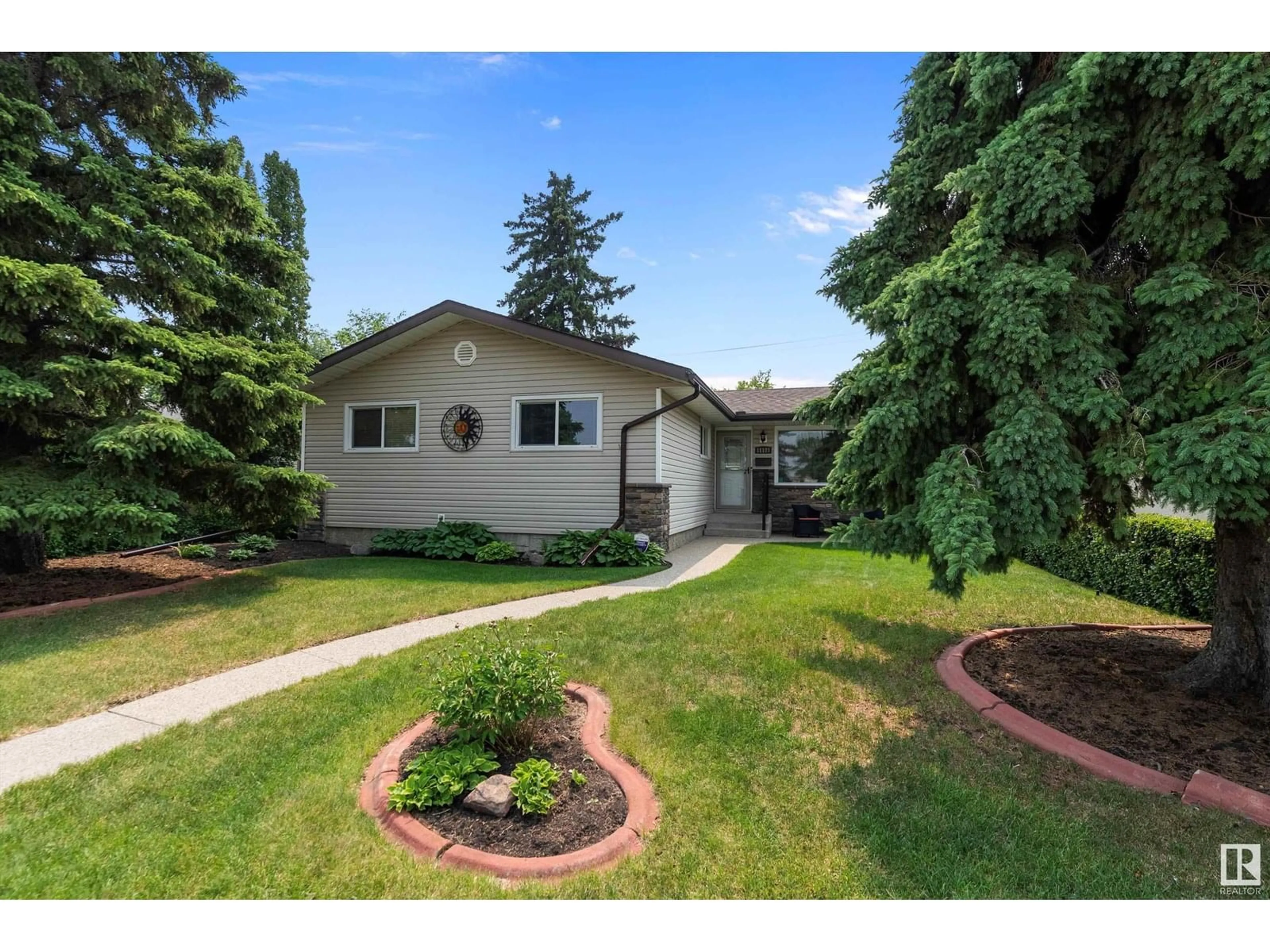 Home with vinyl exterior material, street for 11127 43 AV, Edmonton Alberta T6J0X6