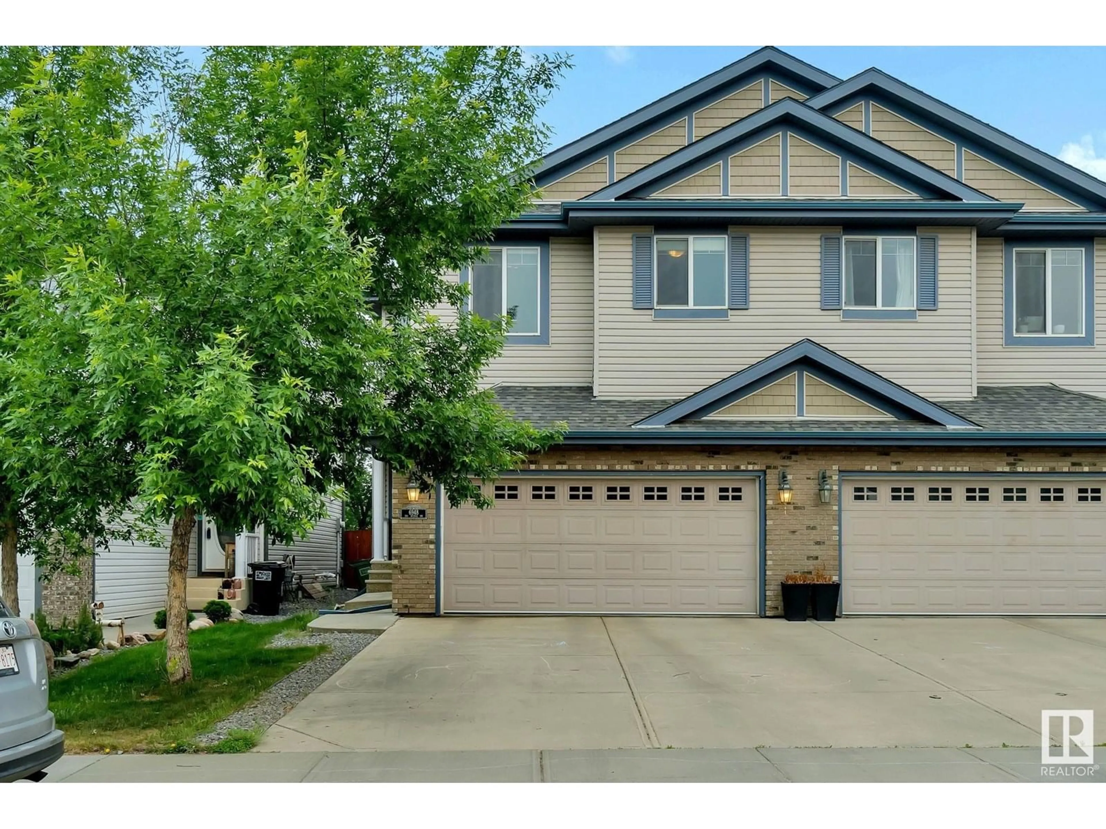 Home with vinyl exterior material, street for 6948 19A AV, Edmonton Alberta T6X0L7