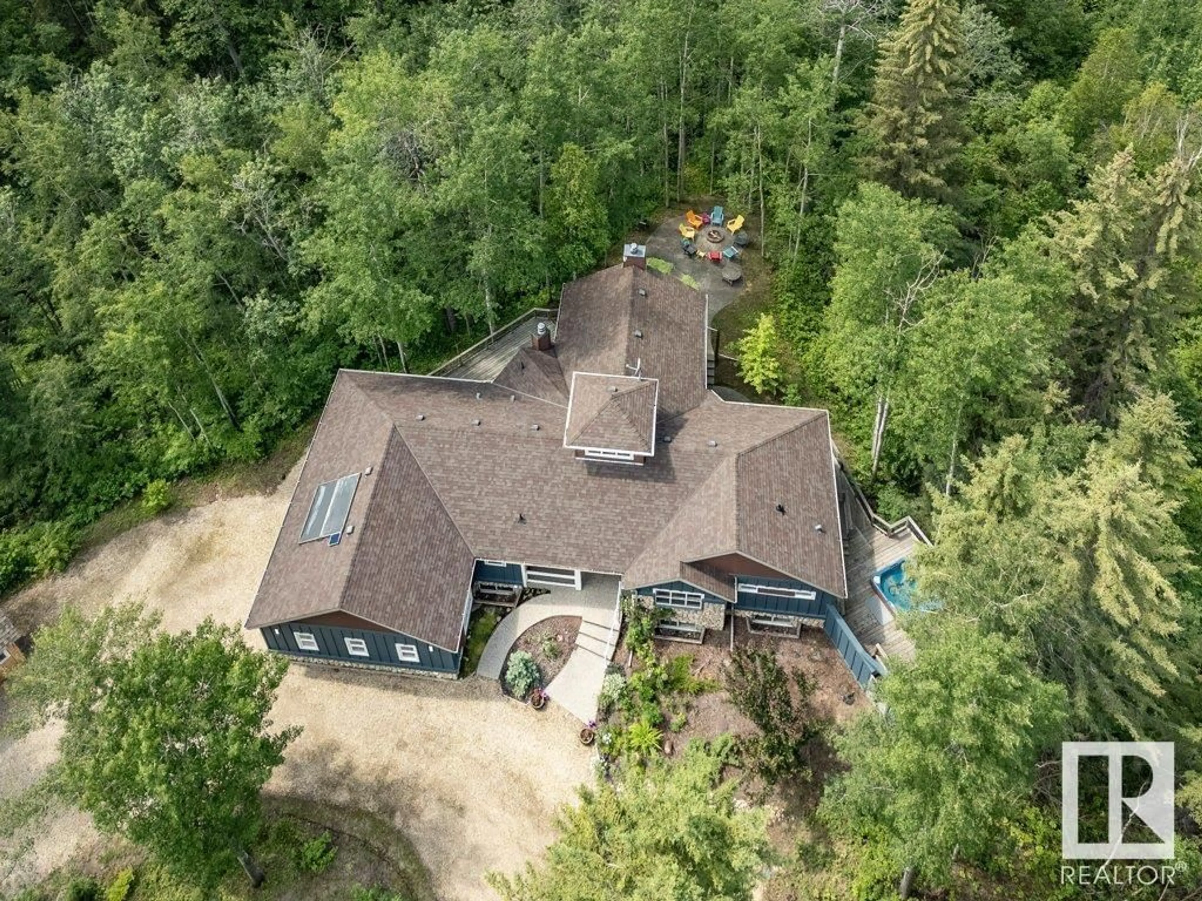 A pic from outside/outdoor area/front of a property/back of a property/a pic from drone, forest/trees view for 134 HERON POINT CLOSE, Rural Wetaskiwin County Alberta T0C2V0
