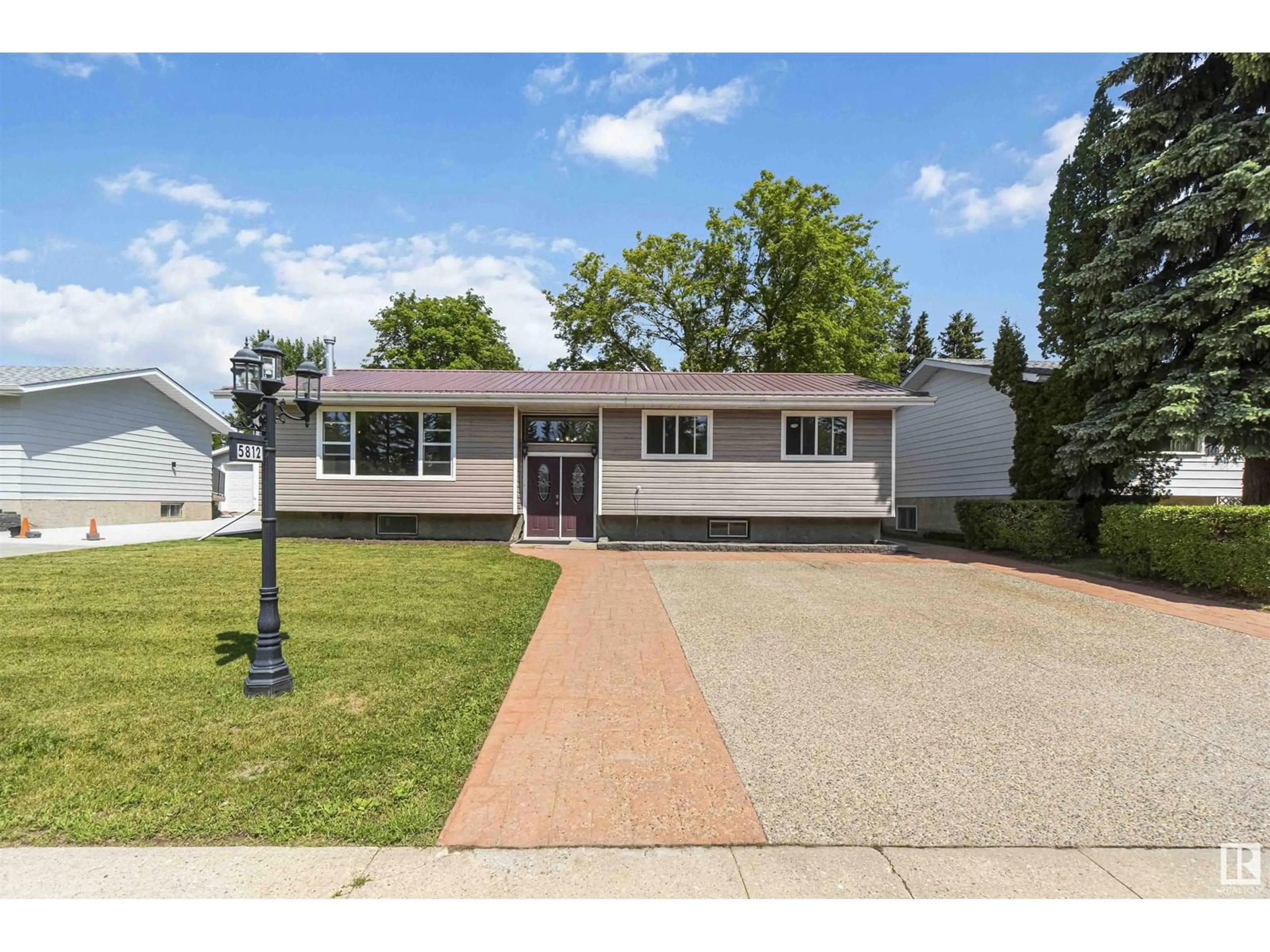 Home with vinyl exterior material, street for 5812 49 AV, Redwater Alberta T0A2W0