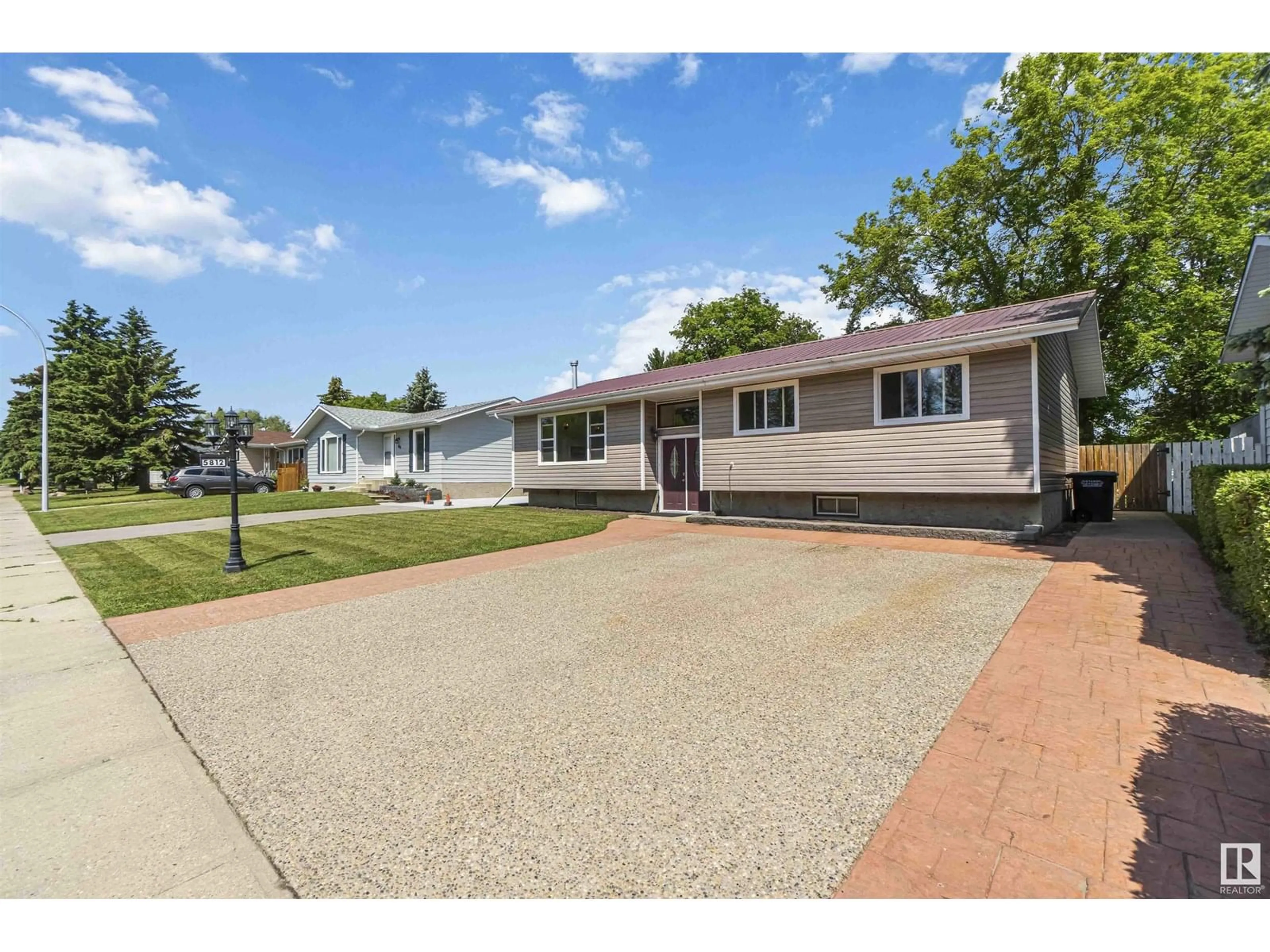 Home with vinyl exterior material, street for 5812 49 AV, Redwater Alberta T0A2W0