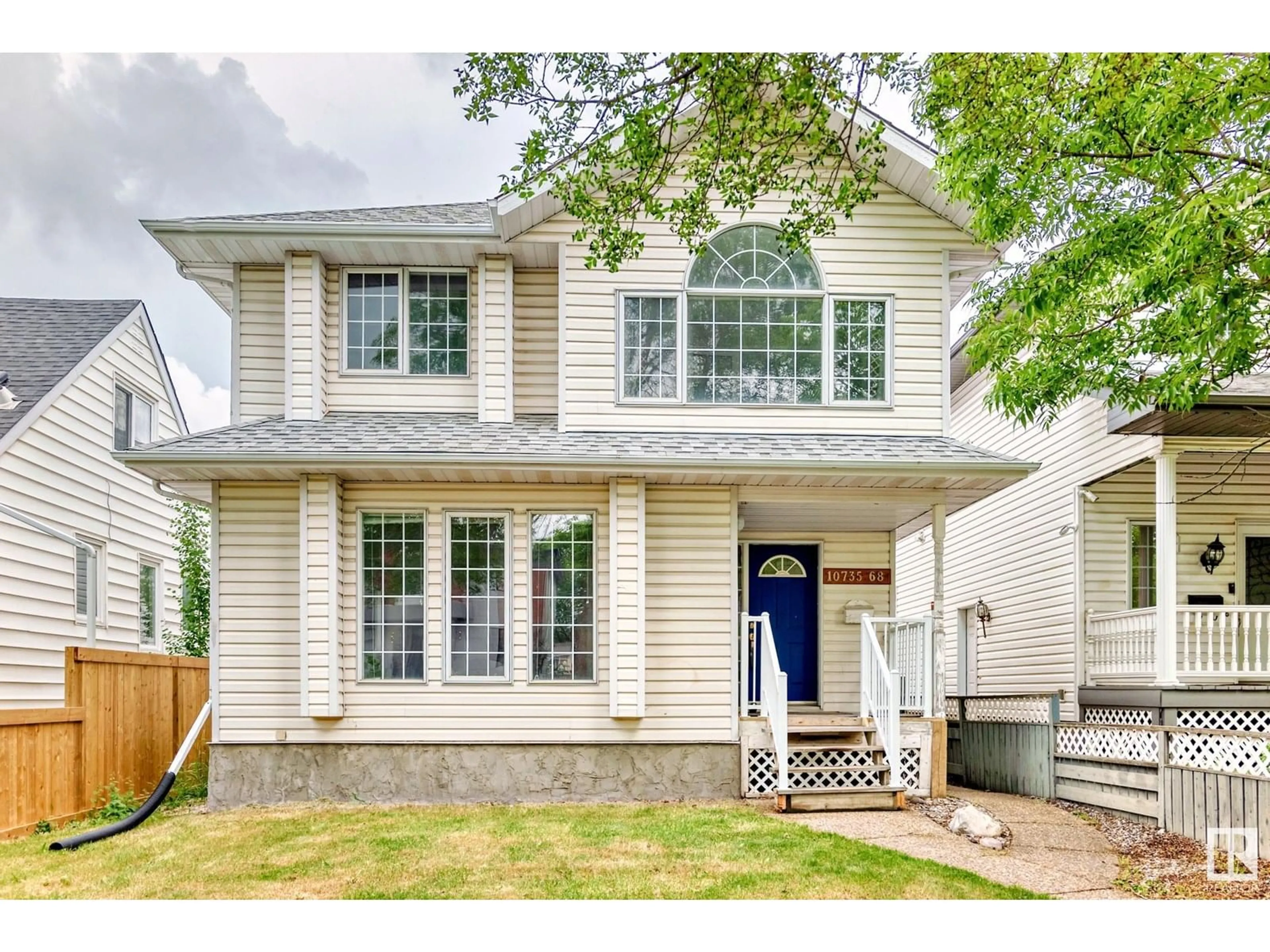 Home with vinyl exterior material, street for 10735 68 AV, Edmonton Alberta T6H2B6