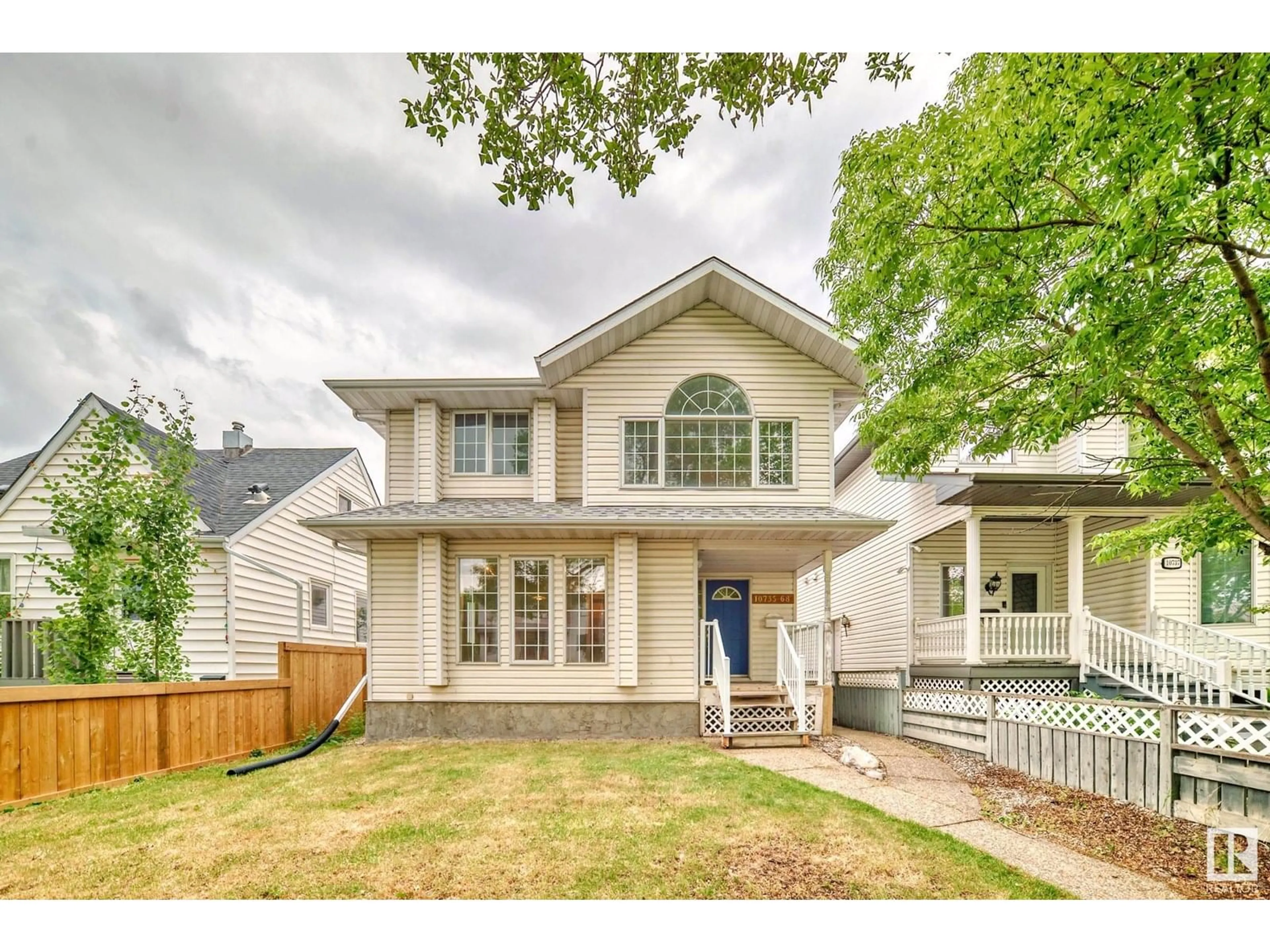 Home with vinyl exterior material, street for 10735 68 AV, Edmonton Alberta T6H2B6