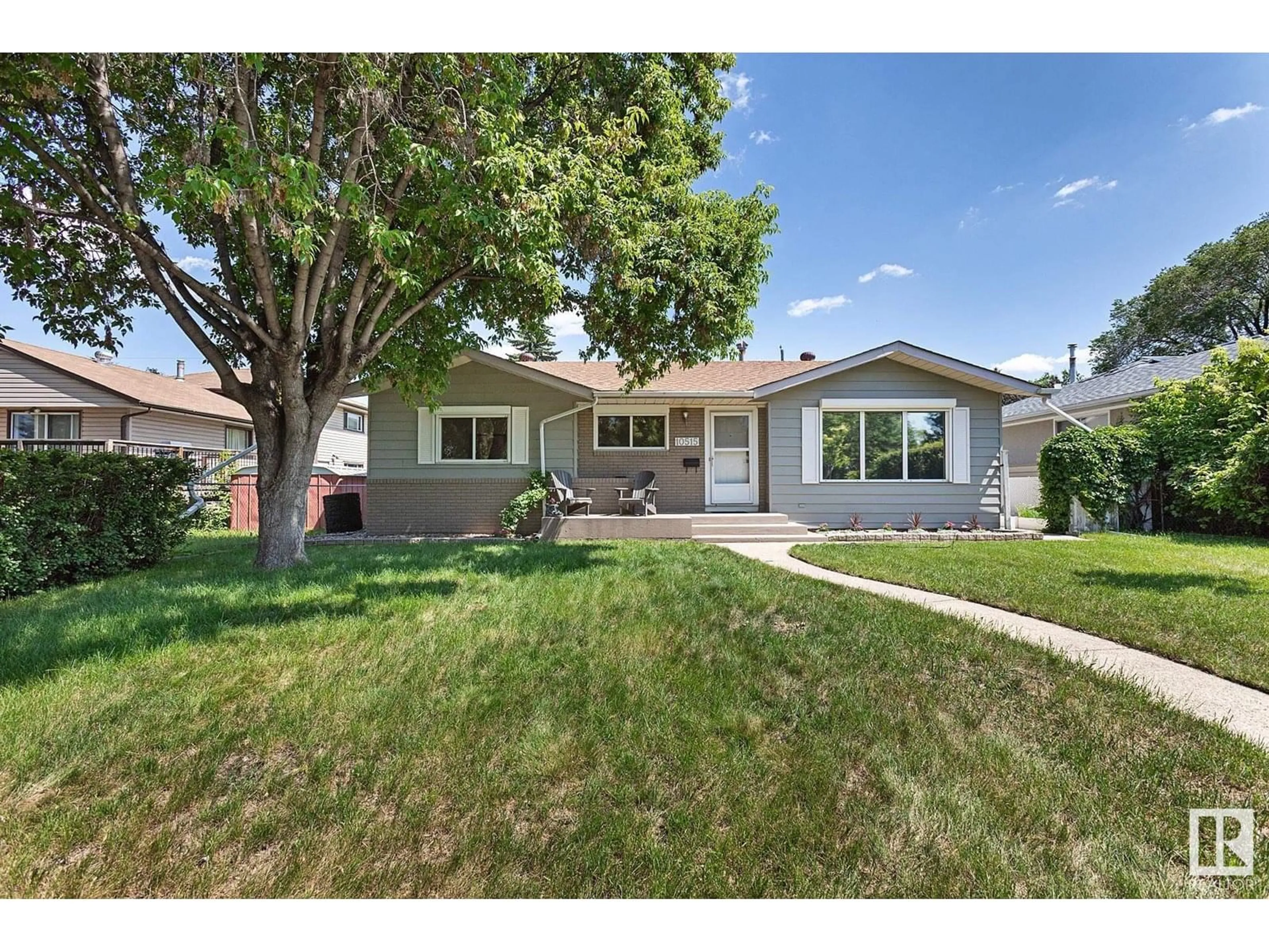 Home with vinyl exterior material, street for NW - 10515 46 ST, Edmonton Alberta T6A1Y2