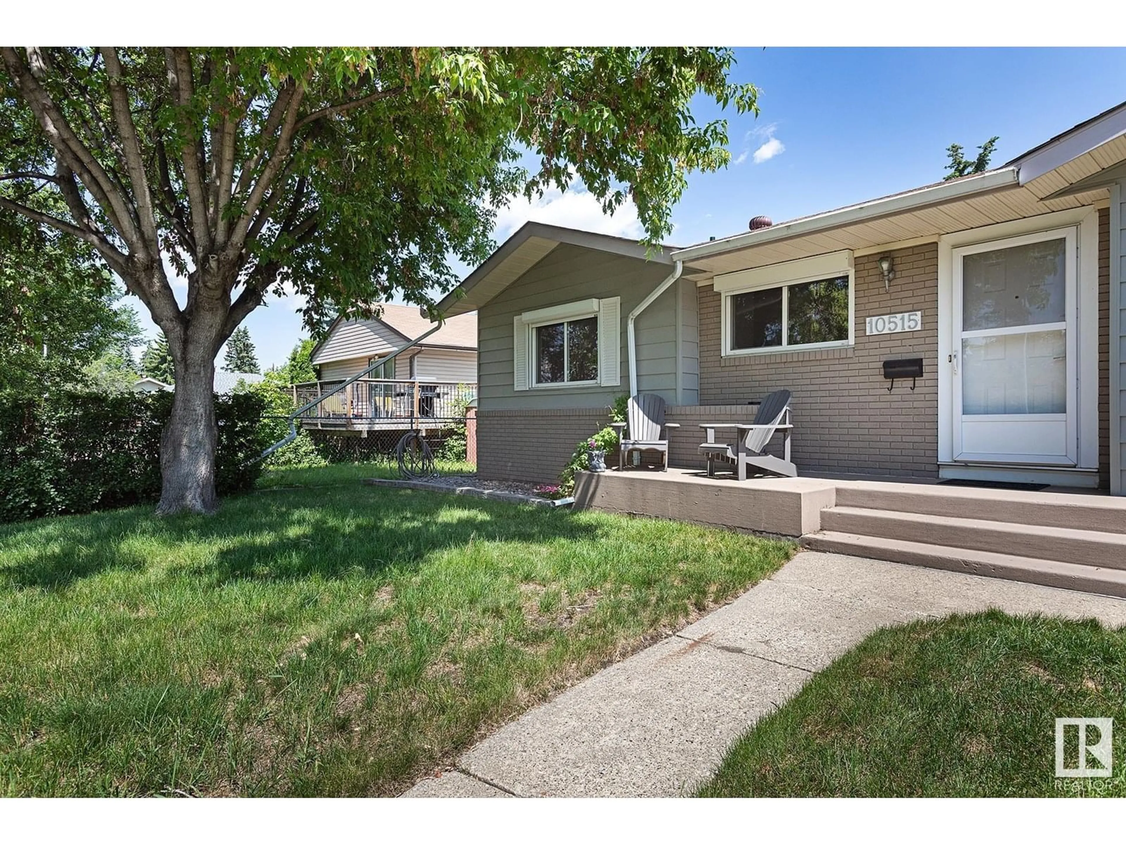 Home with vinyl exterior material, street for NW - 10515 46 ST, Edmonton Alberta T6A1Y2