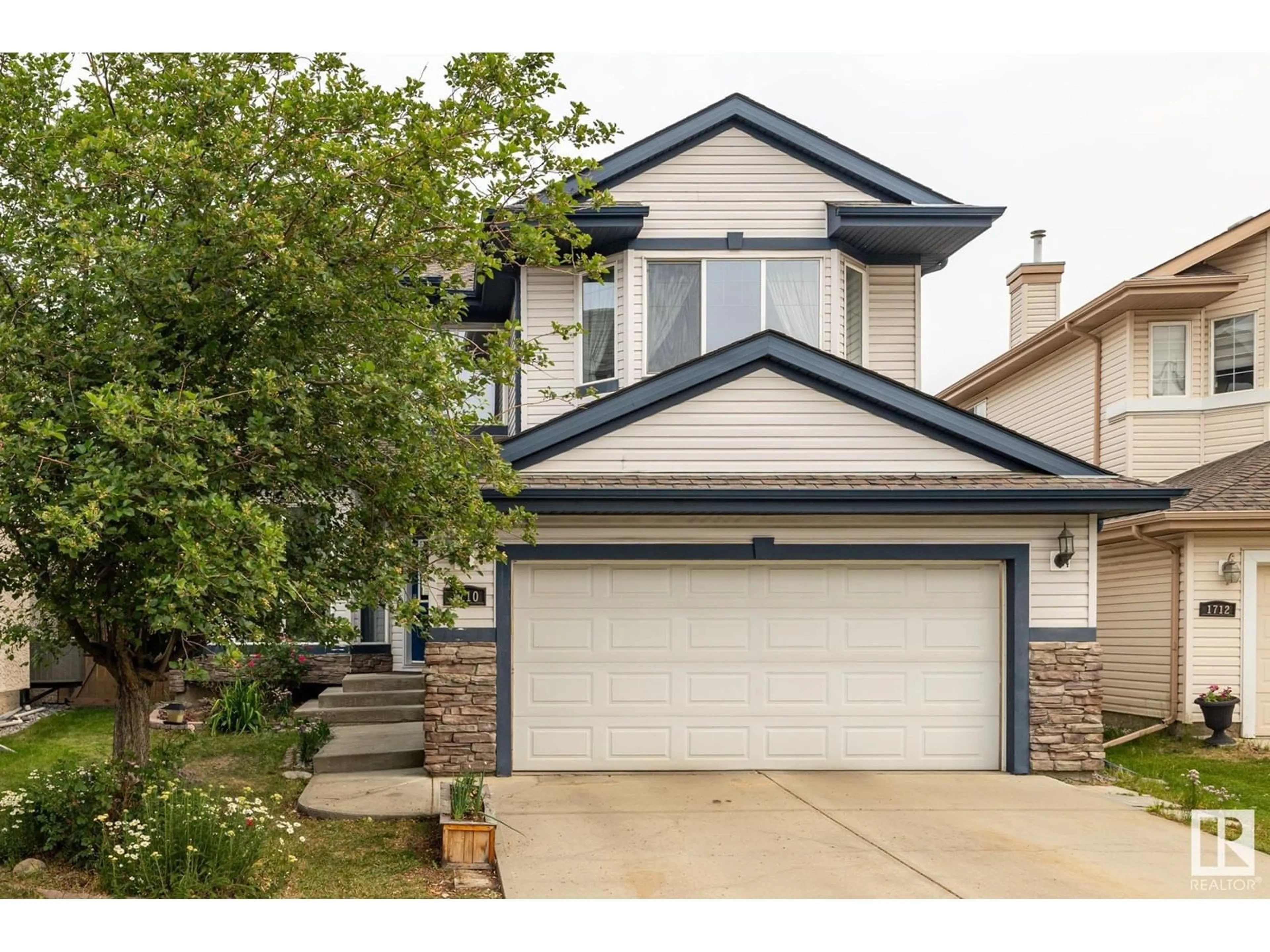 Home with vinyl exterior material, street for 1710 HODGSON PL, Edmonton Alberta T6R3R6
