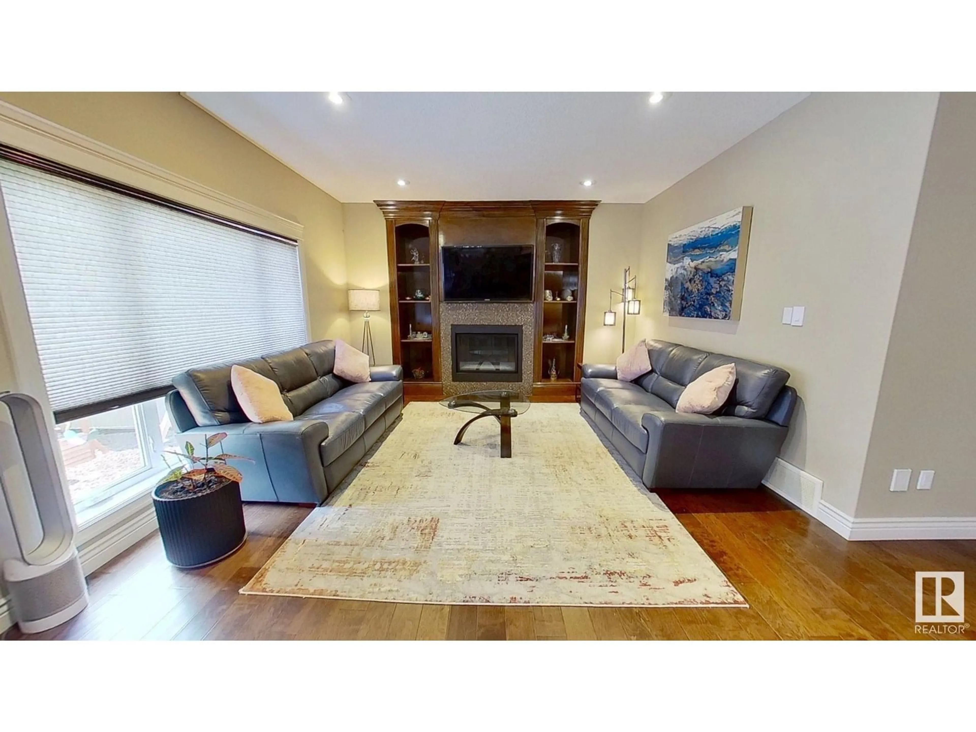Living room with furniture, wood/laminate floor for 1005 DOWNEY WY, Edmonton Alberta T6M2V4