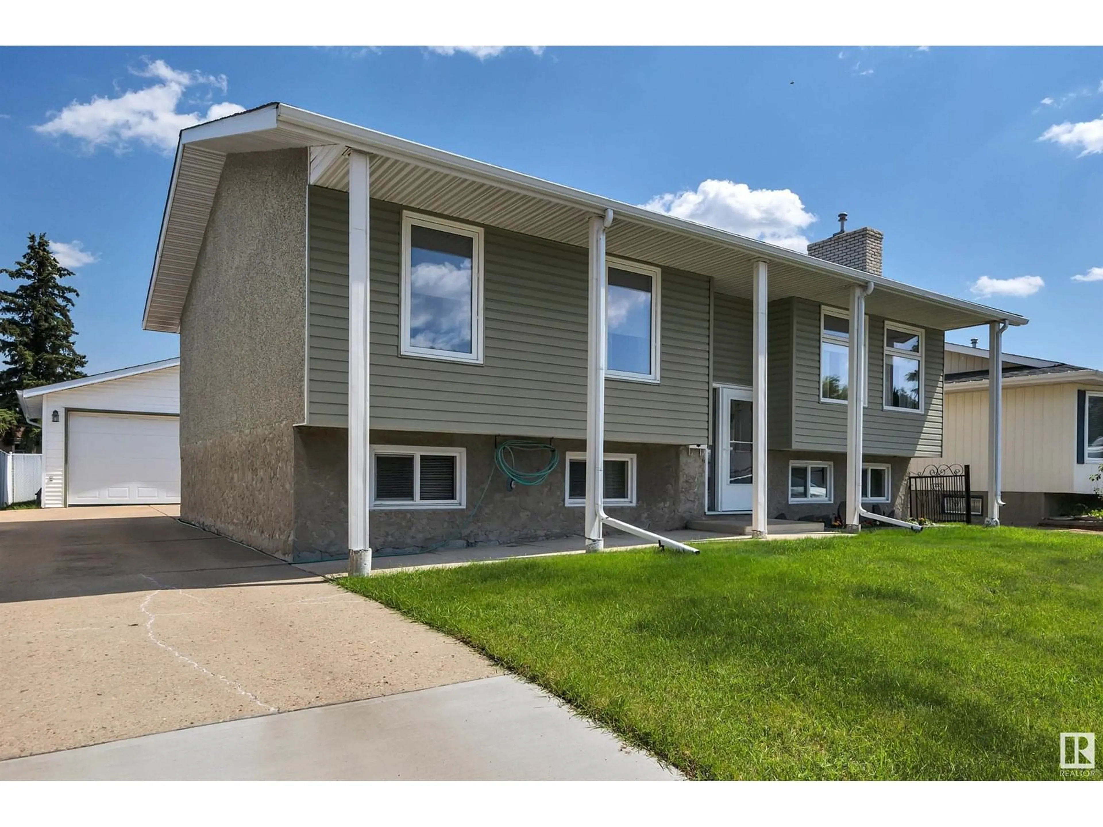 Home with vinyl exterior material, street for NW - 13527 27 ST, Edmonton Alberta T5A3W7