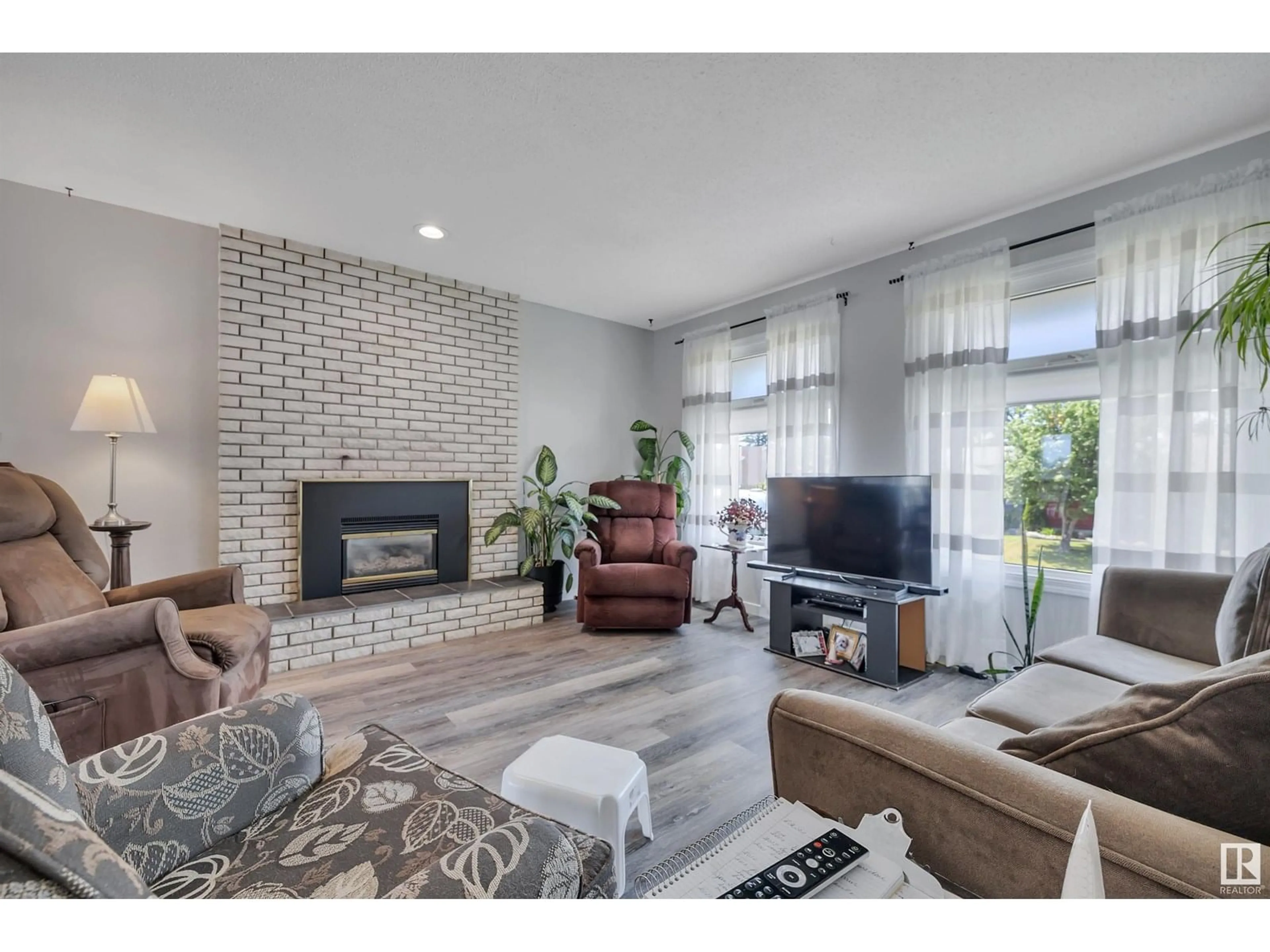 Living room with furniture, ceramic/tile floor for NW - 13527 27 ST, Edmonton Alberta T5A3W7