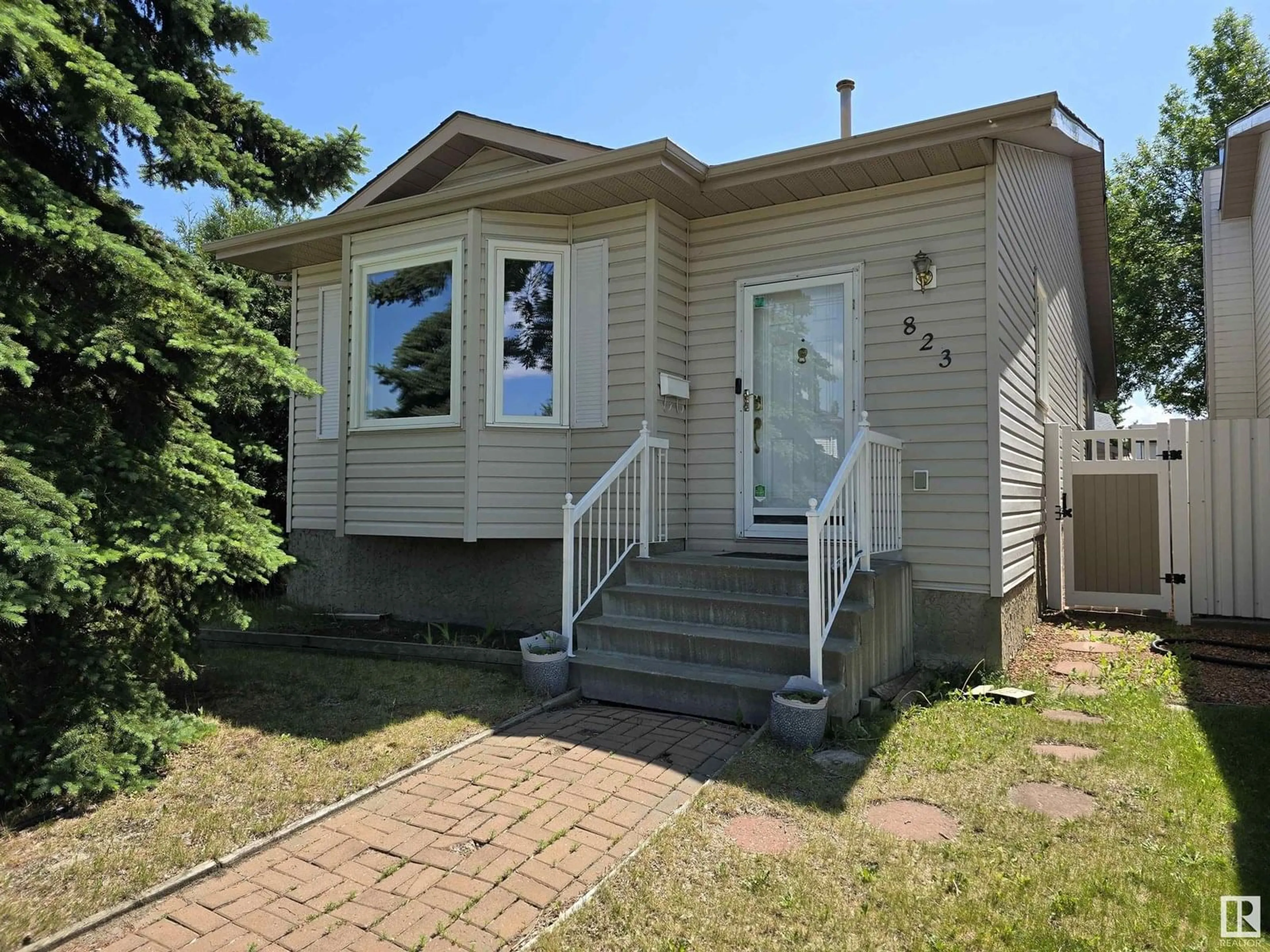 Home with vinyl exterior material, street for 823 JOHNS CL, Edmonton Alberta T6L6P2