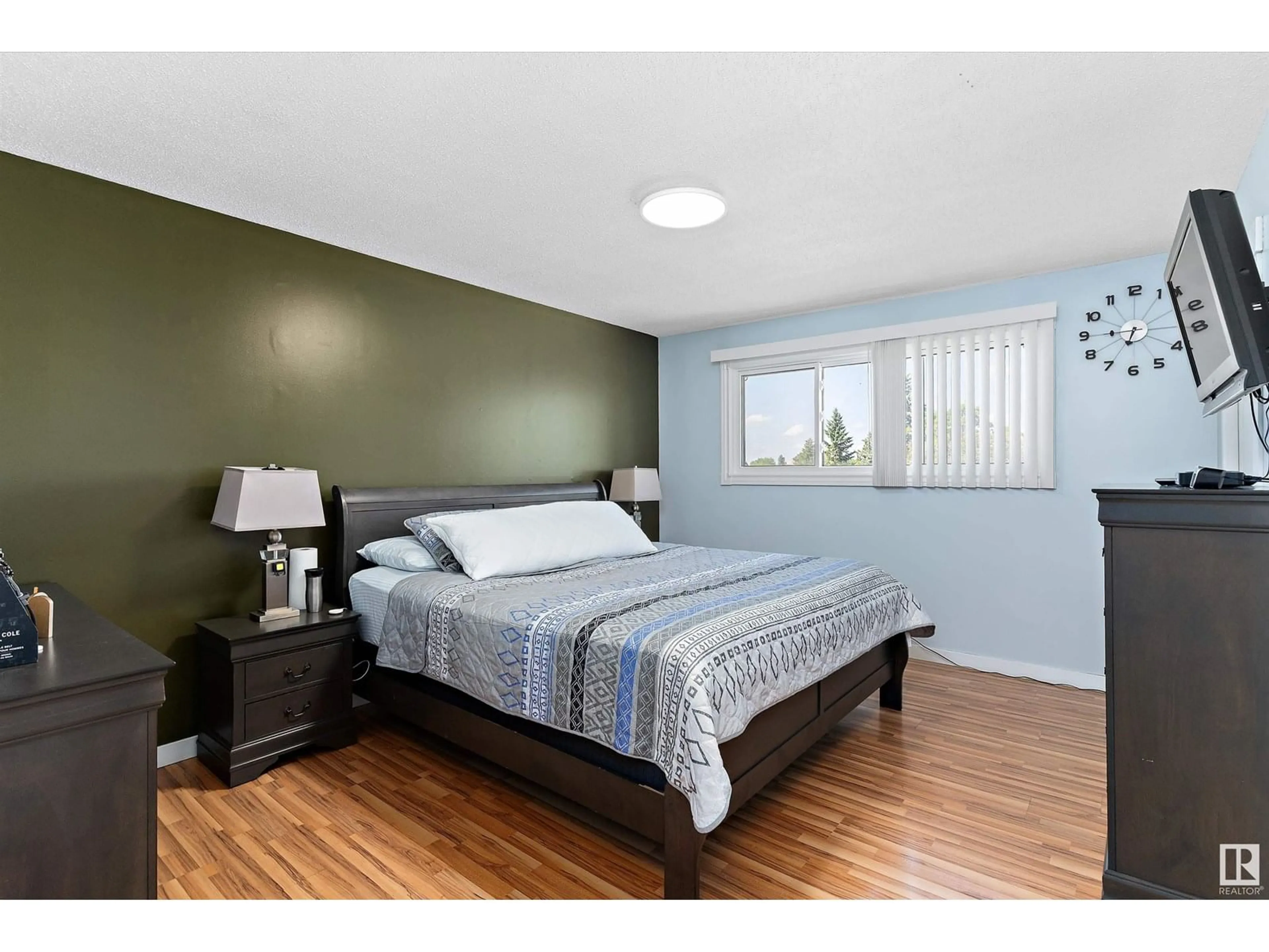 Bedroom with bed, wood/laminate floor for NW - 17315 78 AV, Edmonton Alberta T5T0A8