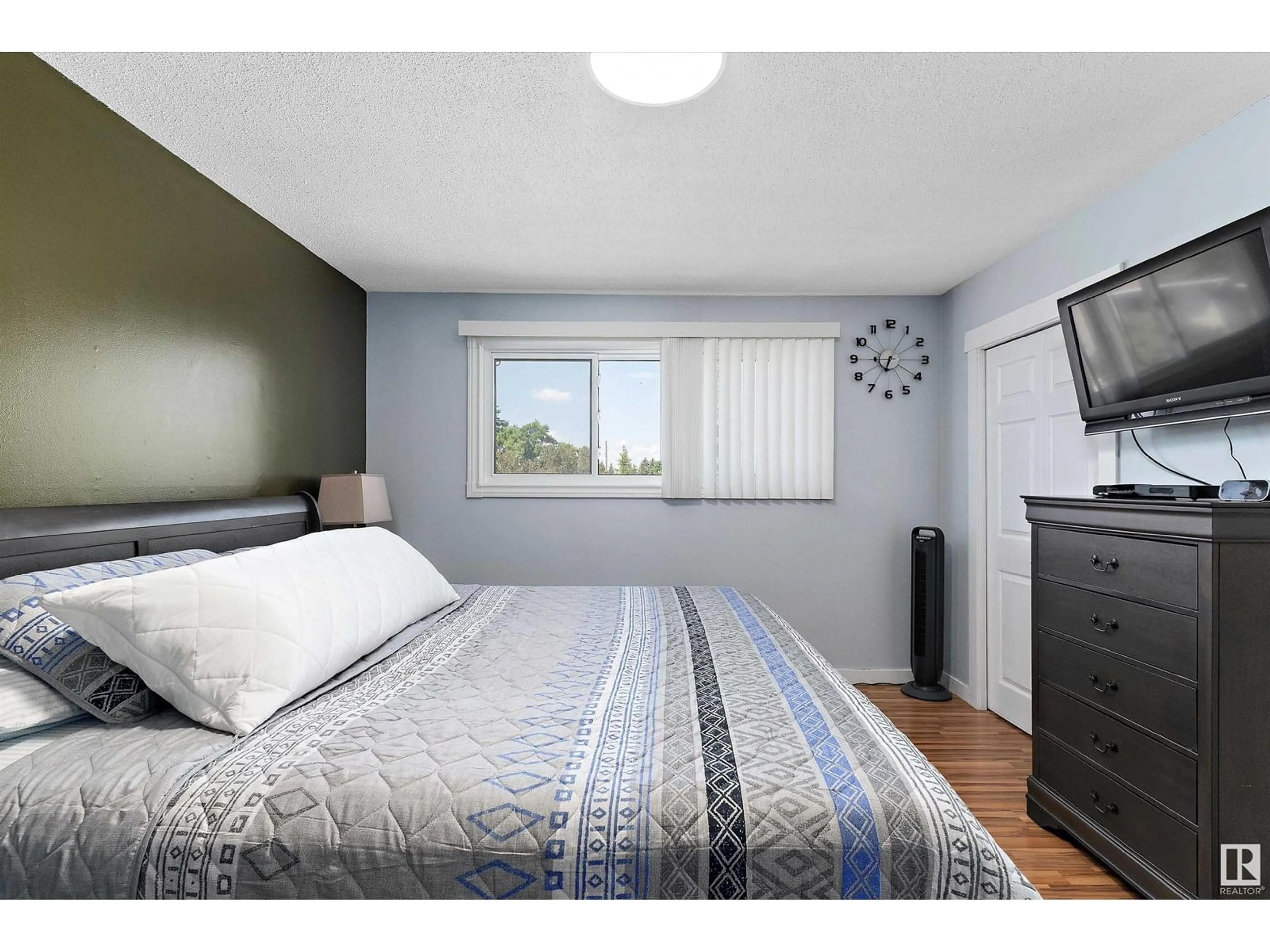 Bedroom with bed, wood/laminate floor for NW - 17315 78 AV, Edmonton Alberta T5T0A8