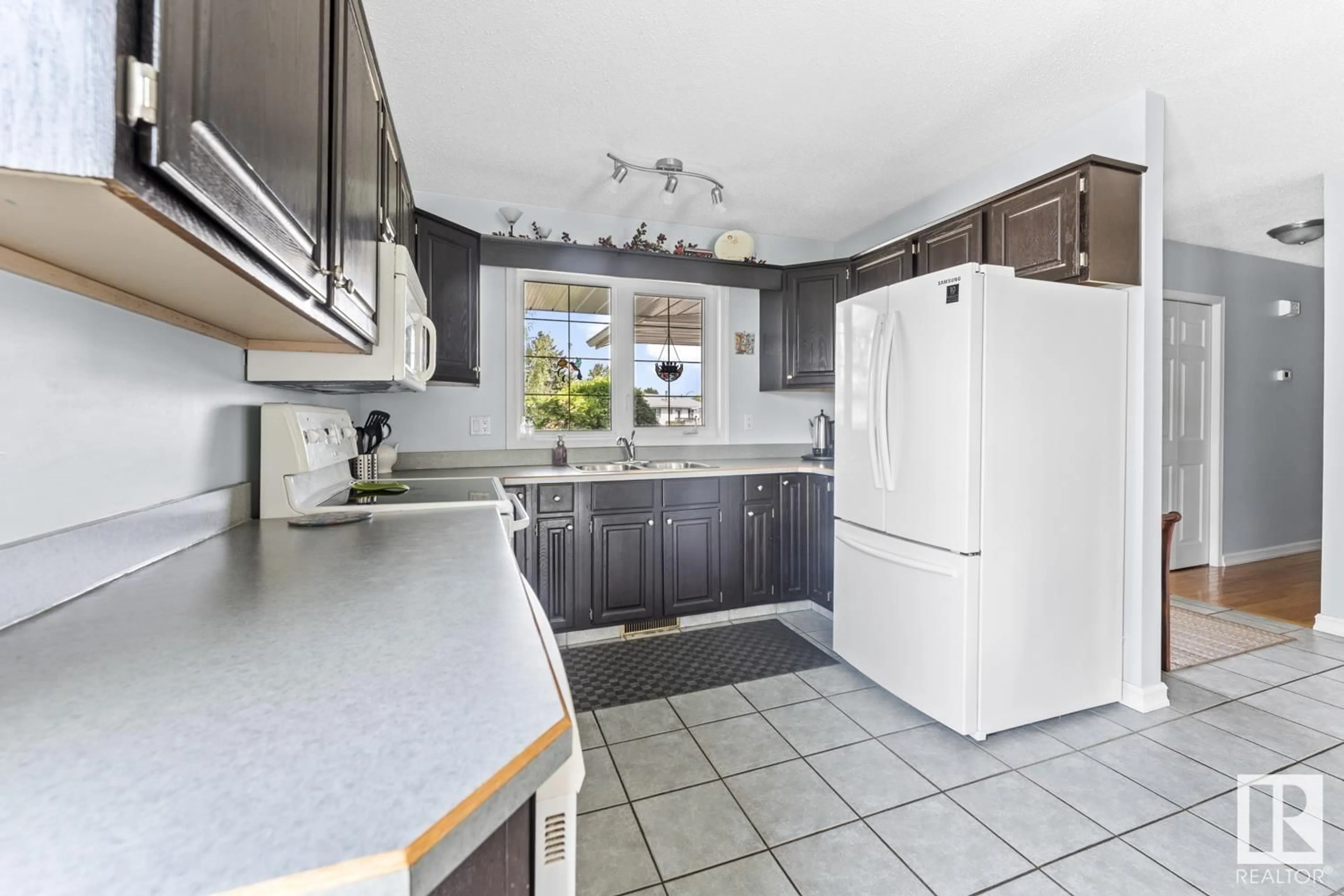 Standard kitchen, ceramic/tile floor for 4504 45 AVE, Bonnyville Town Alberta T9N1X3