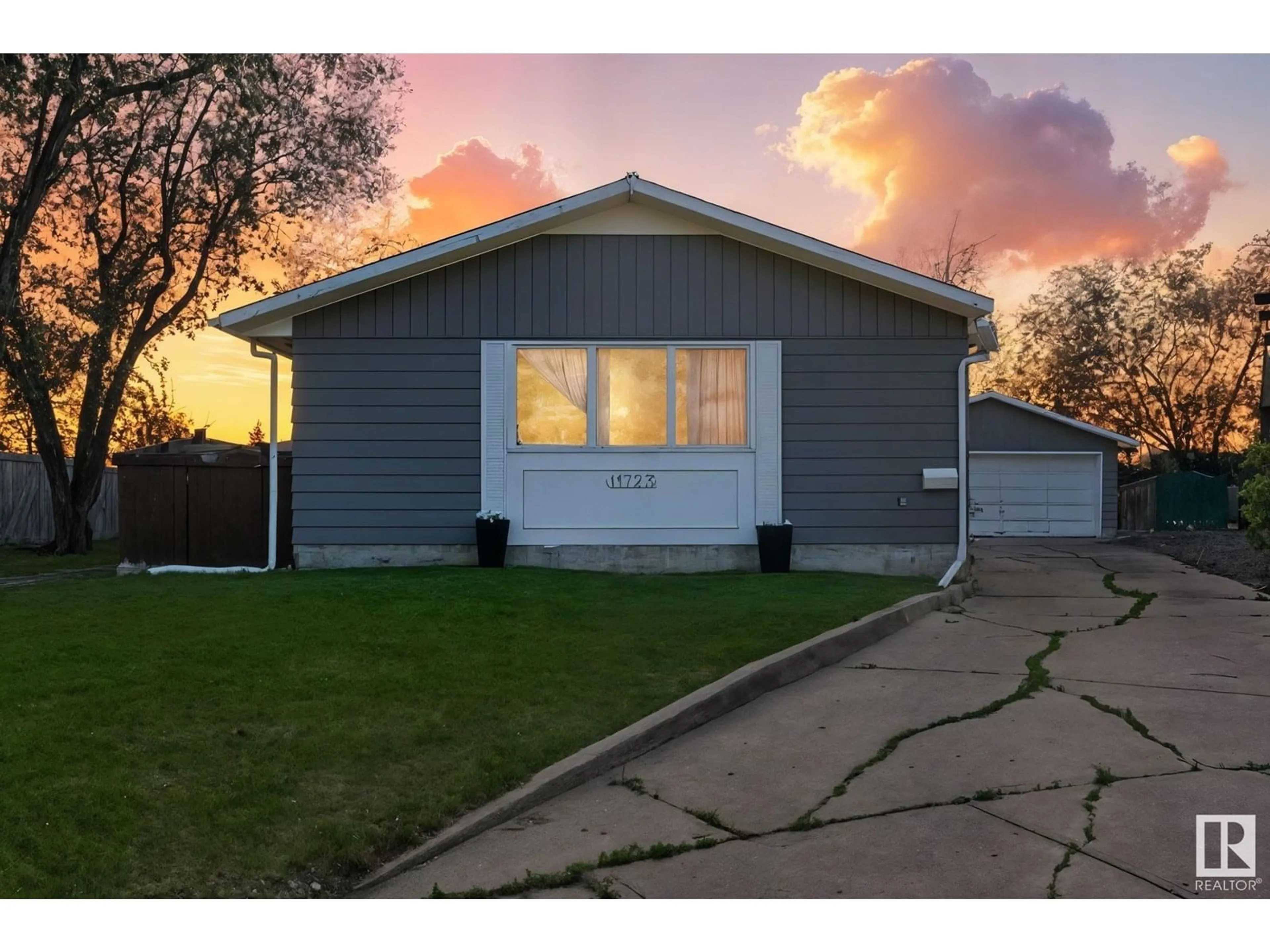Home with vinyl exterior material, street for 11723 144 AV, Edmonton Alberta T5X1M4