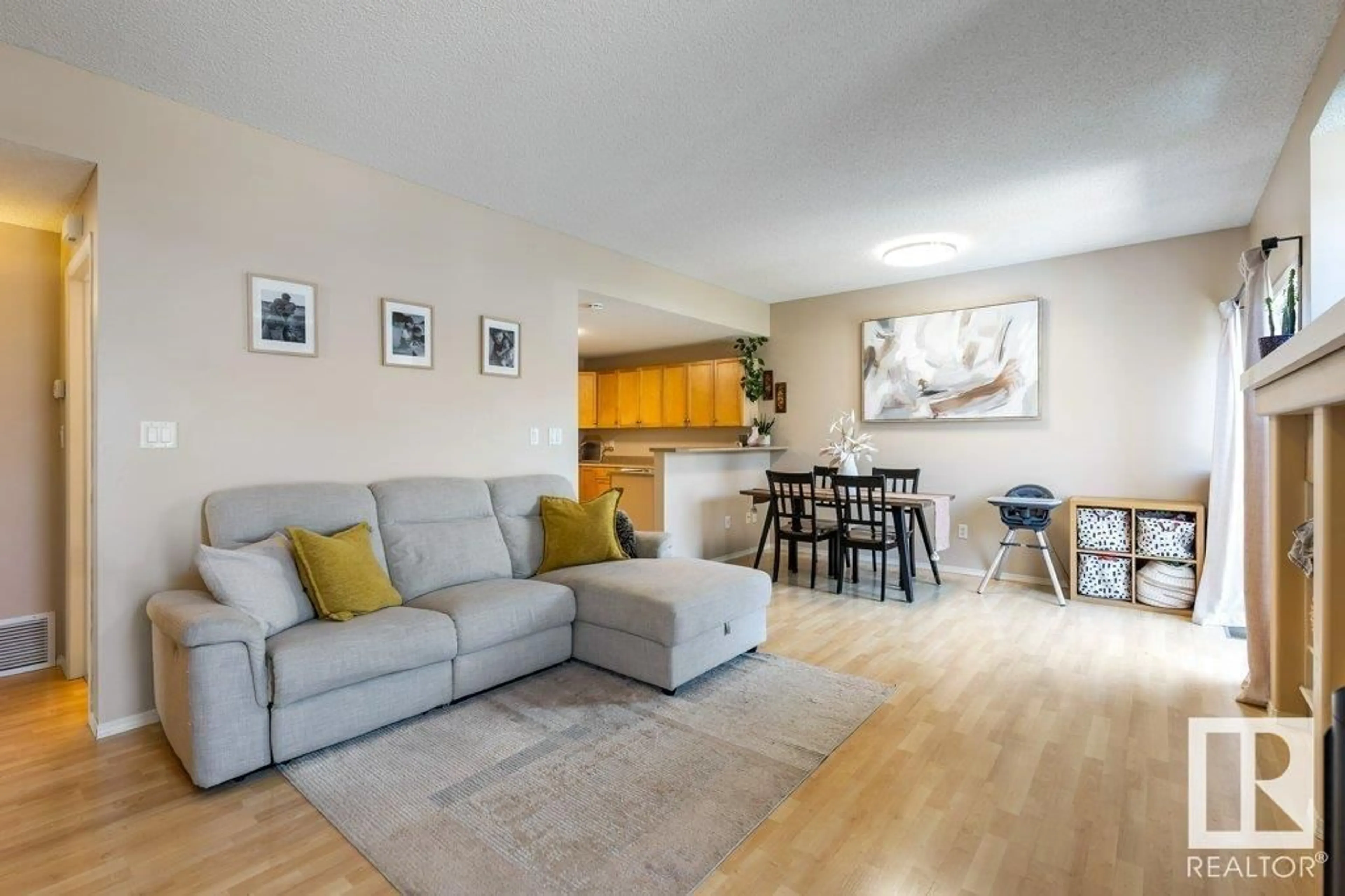 Living room with furniture, wood/laminate floor for #28 - 1179 SUMMERSIDE DR, Edmonton Alberta T6X1K1