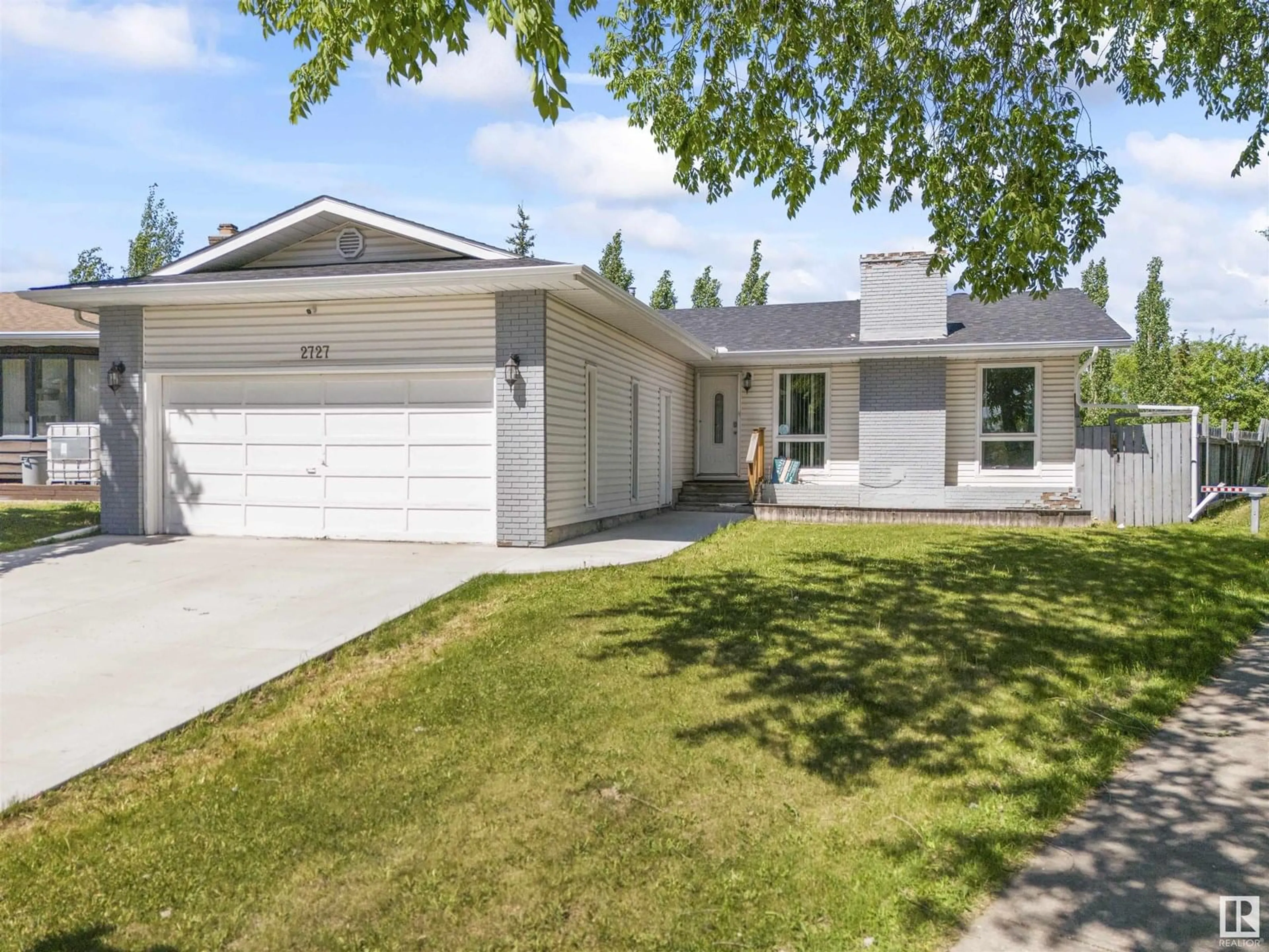 Home with vinyl exterior material, street for 2727 83 STREET, Edmonton Alberta T6K3G7