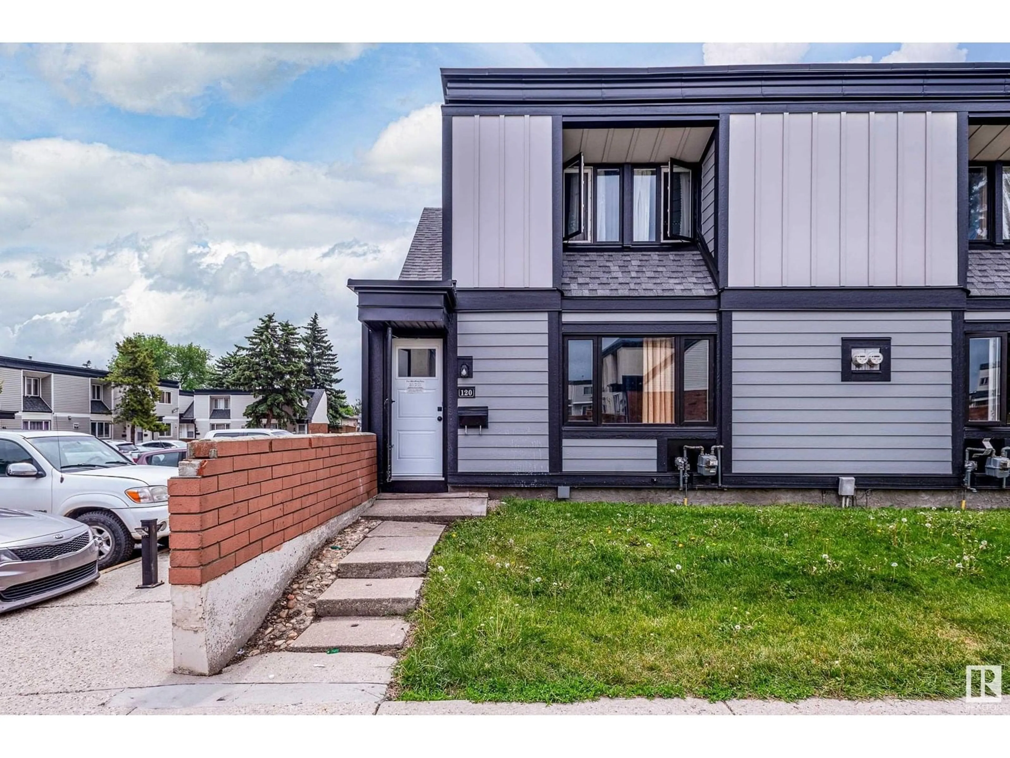 Home with vinyl exterior material, street for #120 - 11421 34 ST, Edmonton Alberta T5W5J7