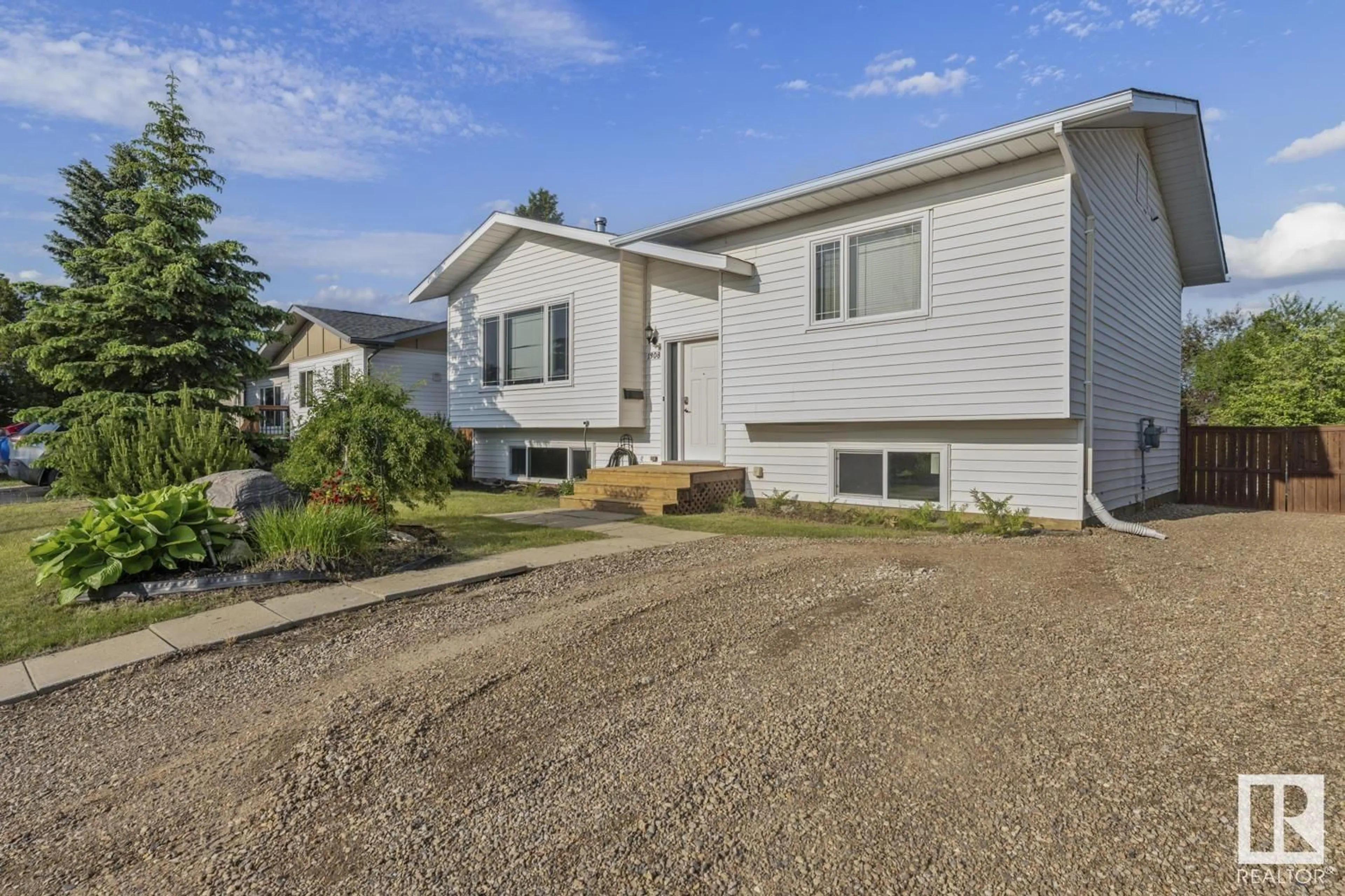 Home with vinyl exterior material, street for 1308 12 ST, Cold Lake Alberta T9M1L1