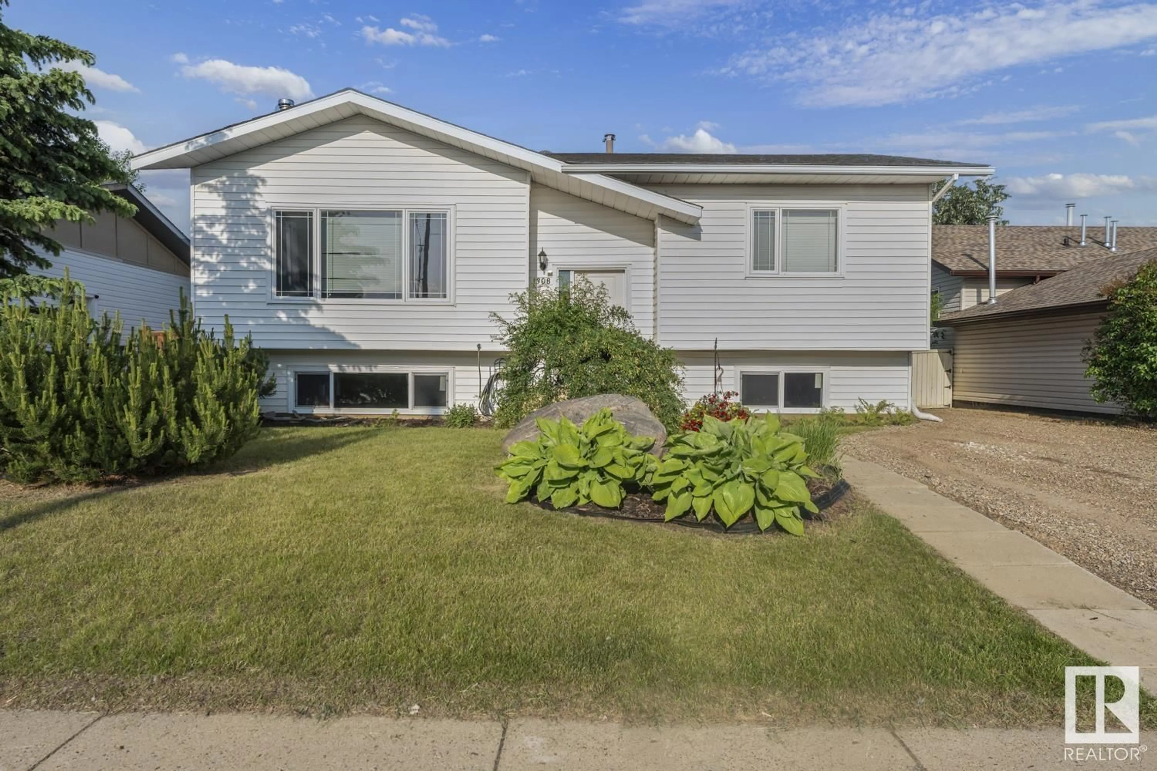 Home with vinyl exterior material, street for 1308 12 ST, Cold Lake Alberta T9M1L1