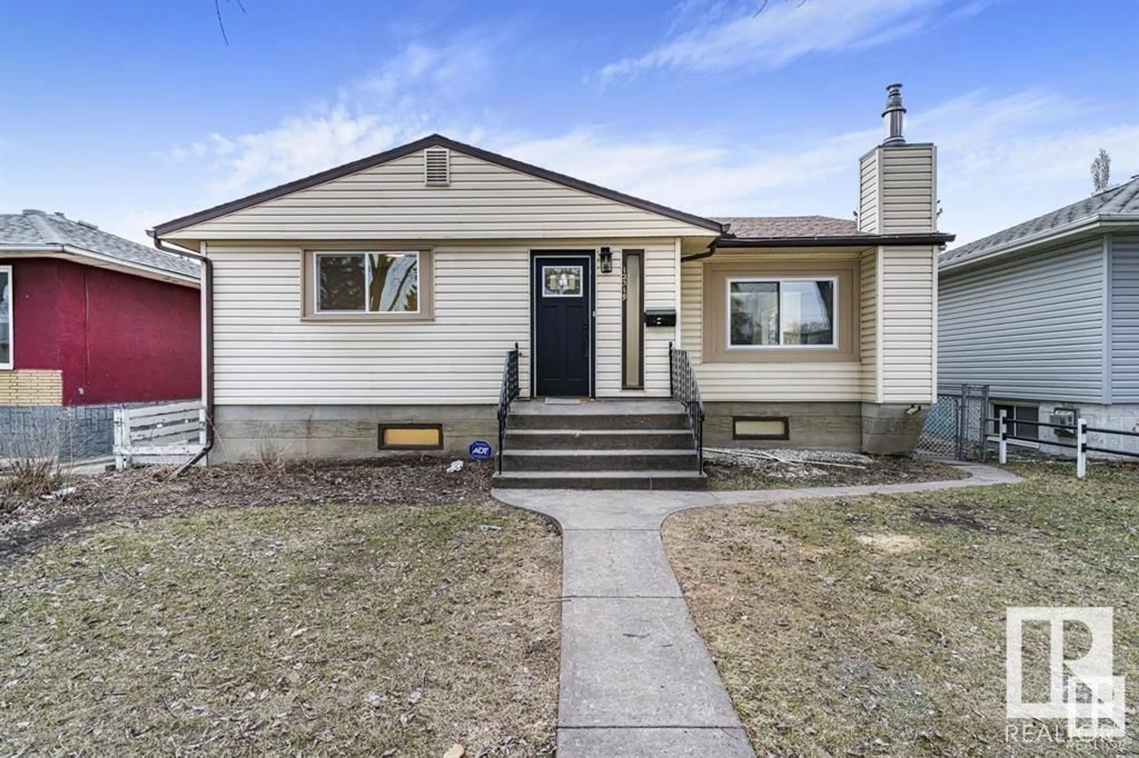 Home with vinyl exterior material, street for NW - 12319 96 ST, Edmonton Alberta T5G1W4