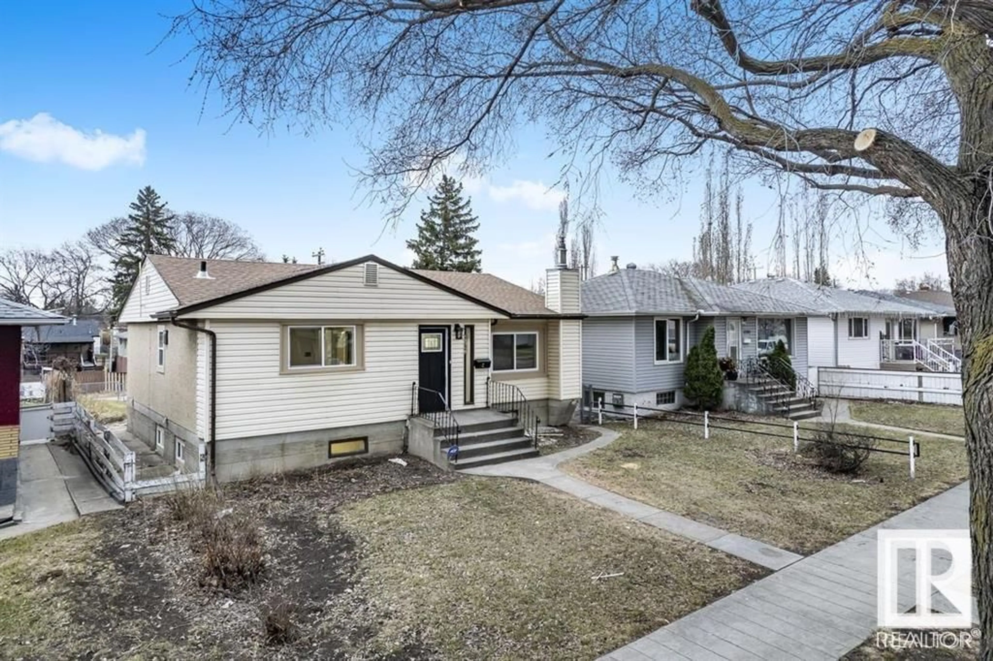 Home with vinyl exterior material, street for NW - 12319 96 ST, Edmonton Alberta T5G1W4