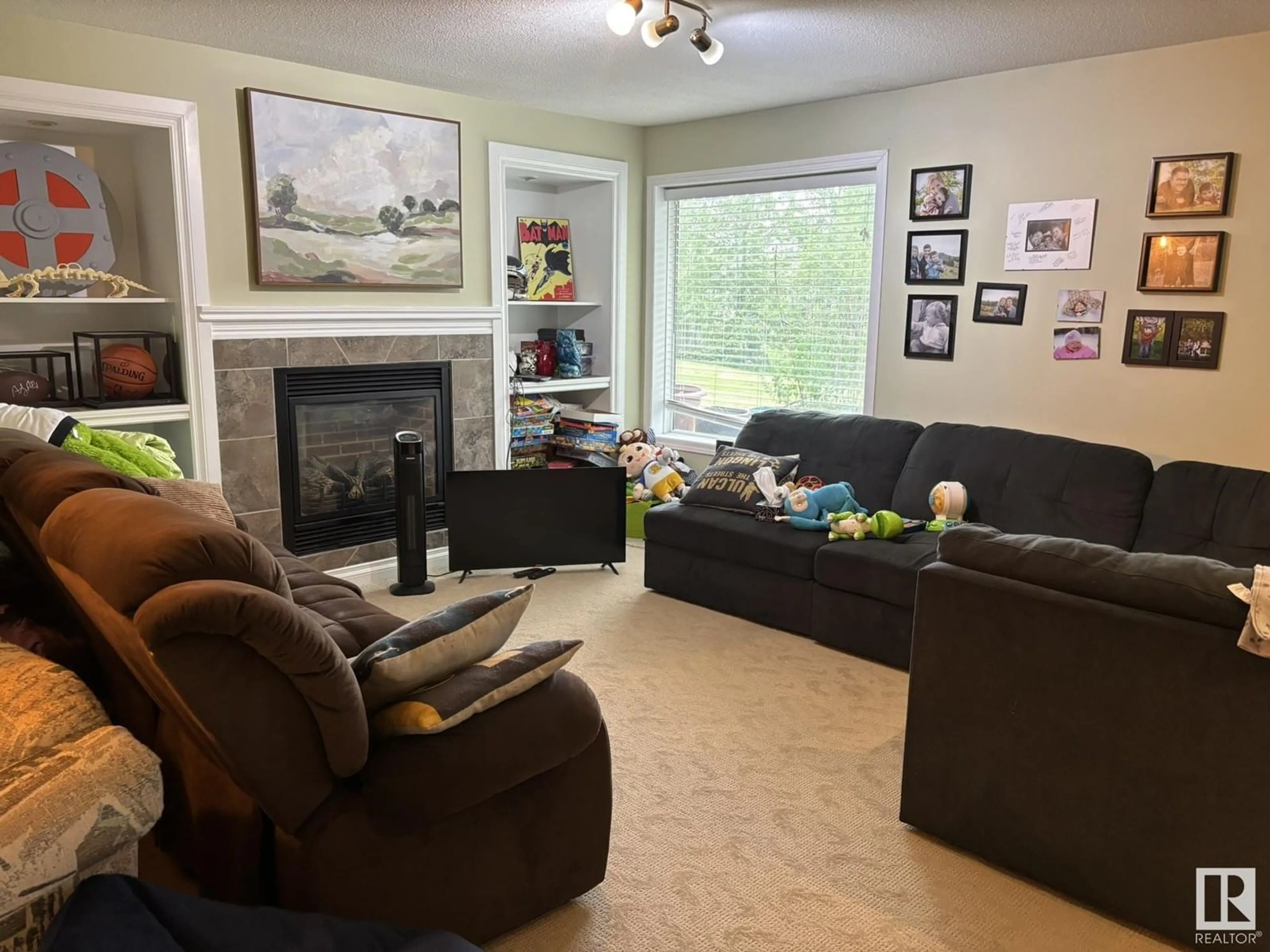 Living room with furniture, wood/laminate floor for NW - 2810 32A ST, Edmonton Alberta T6T1T3