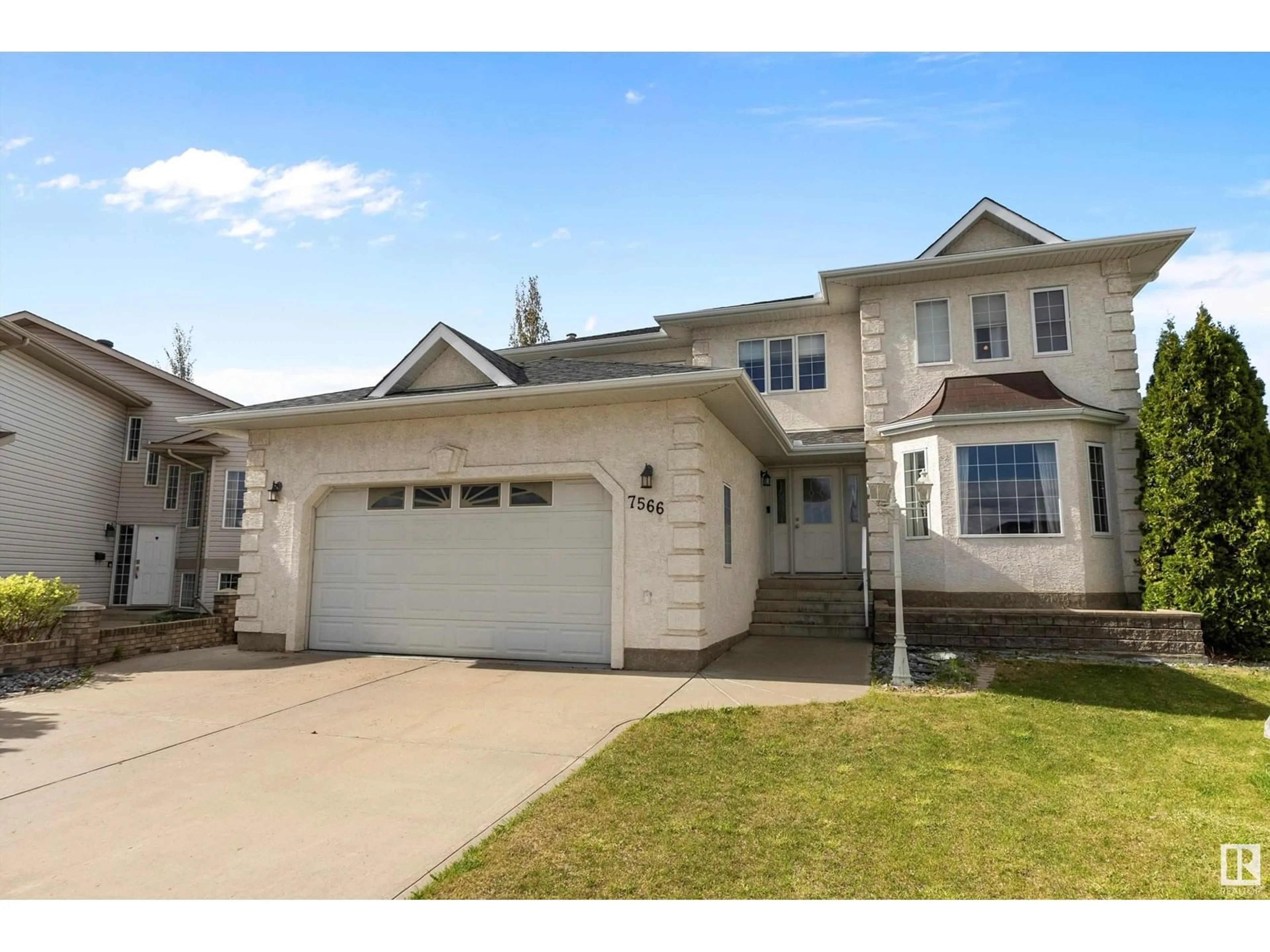 Home with vinyl exterior material, street for 7566 165A AV, Edmonton Alberta T5Z3P9
