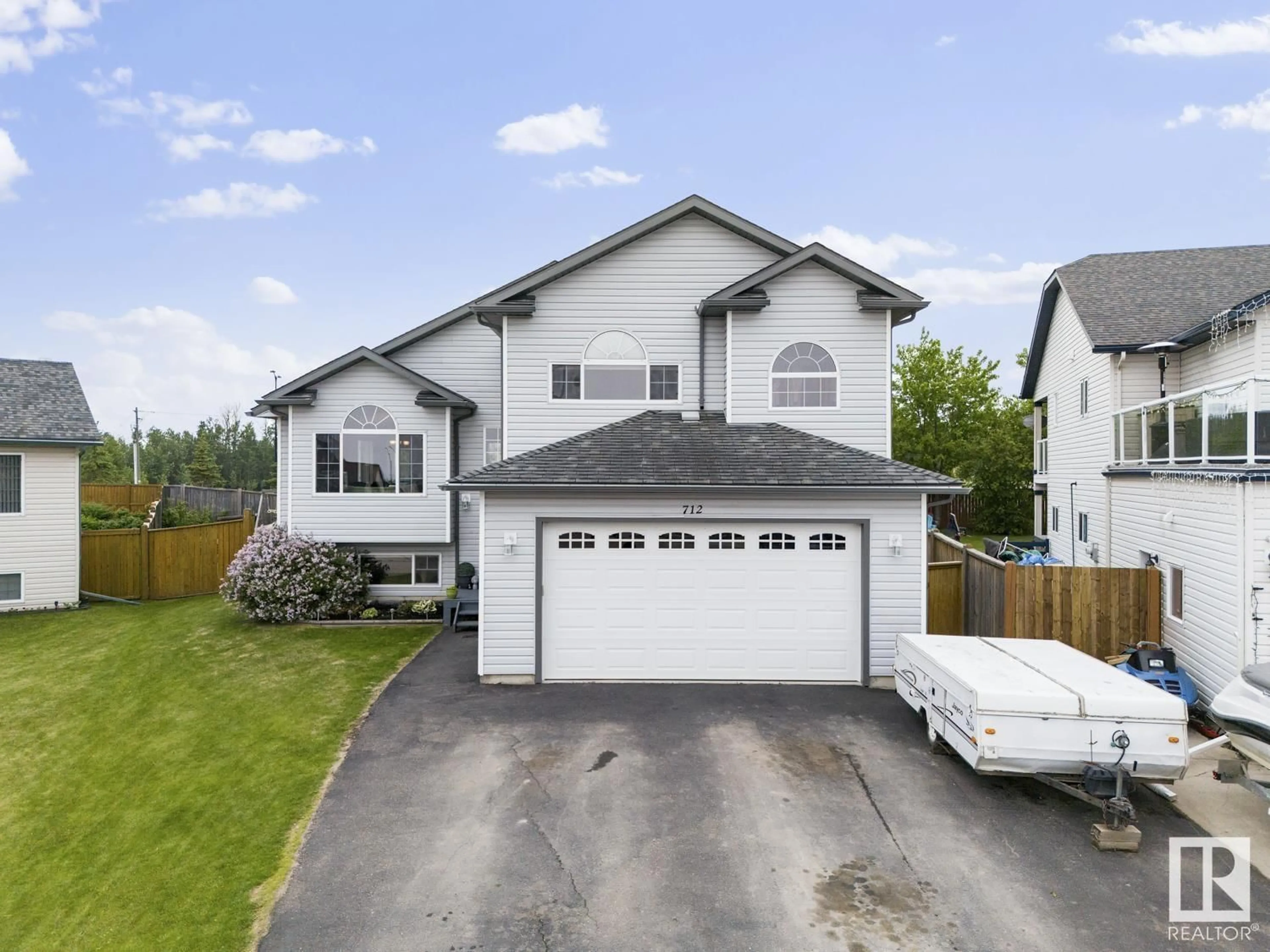 Home with vinyl exterior material, street for 712 GROUSE CL, Cold Lake Alberta T9M0A5