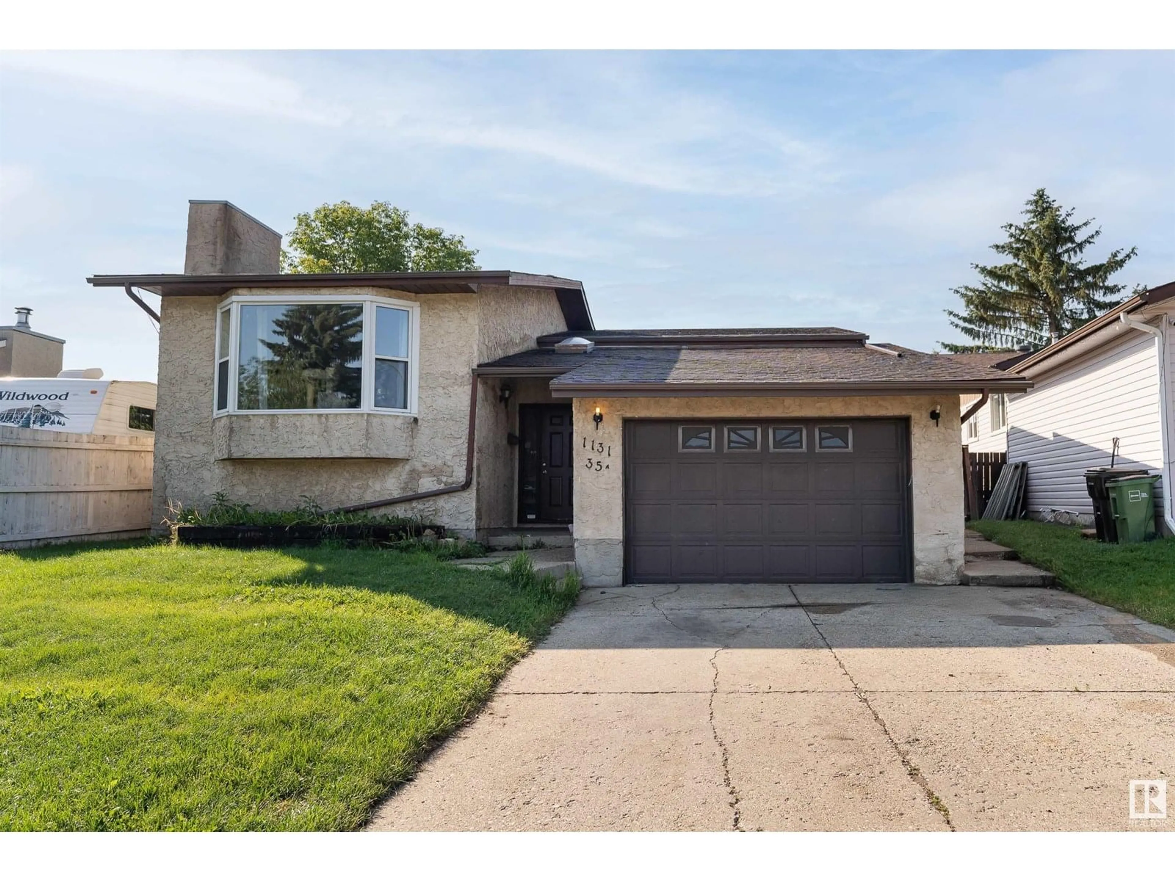 Home with vinyl exterior material, street for 1131 35A ST ST, Edmonton Alberta T6L2L4