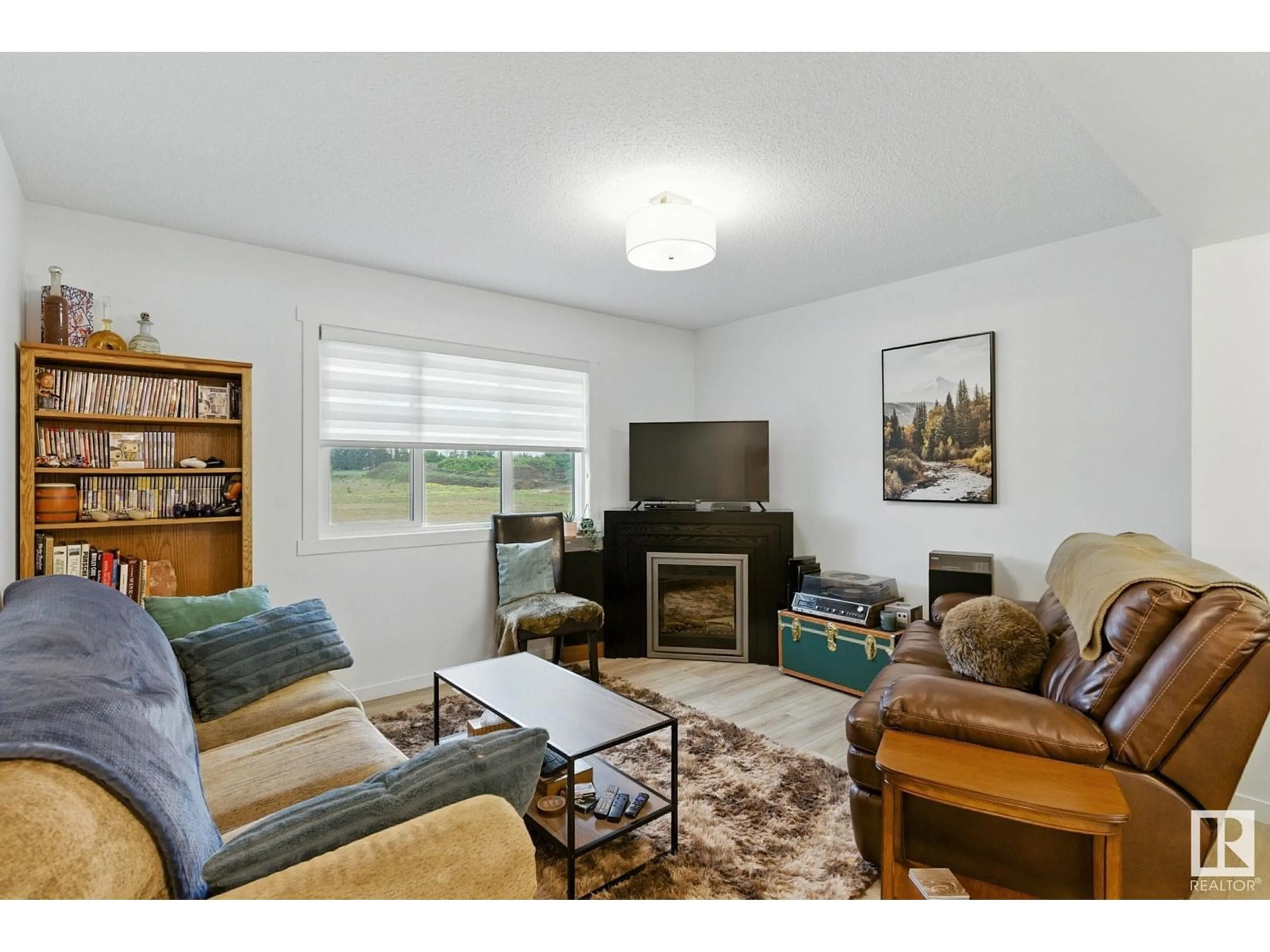 Living room with furniture, wood/laminate floor for 1223 MCLEOD AV, Spruce Grove Alberta T7X4A9