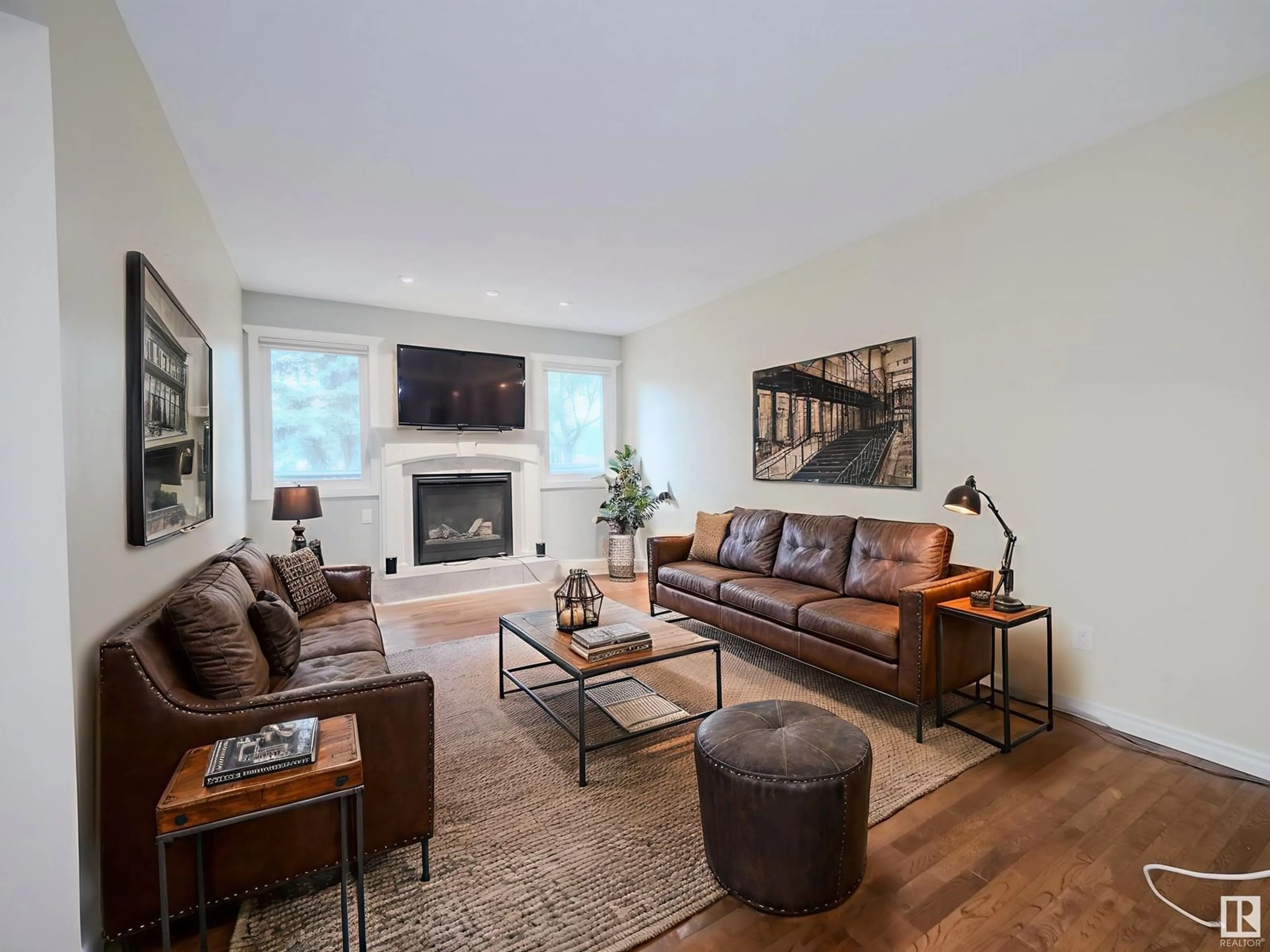 Living room with furniture, wood/laminate floor for 18170 96 AV, Edmonton Alberta T5T3N3