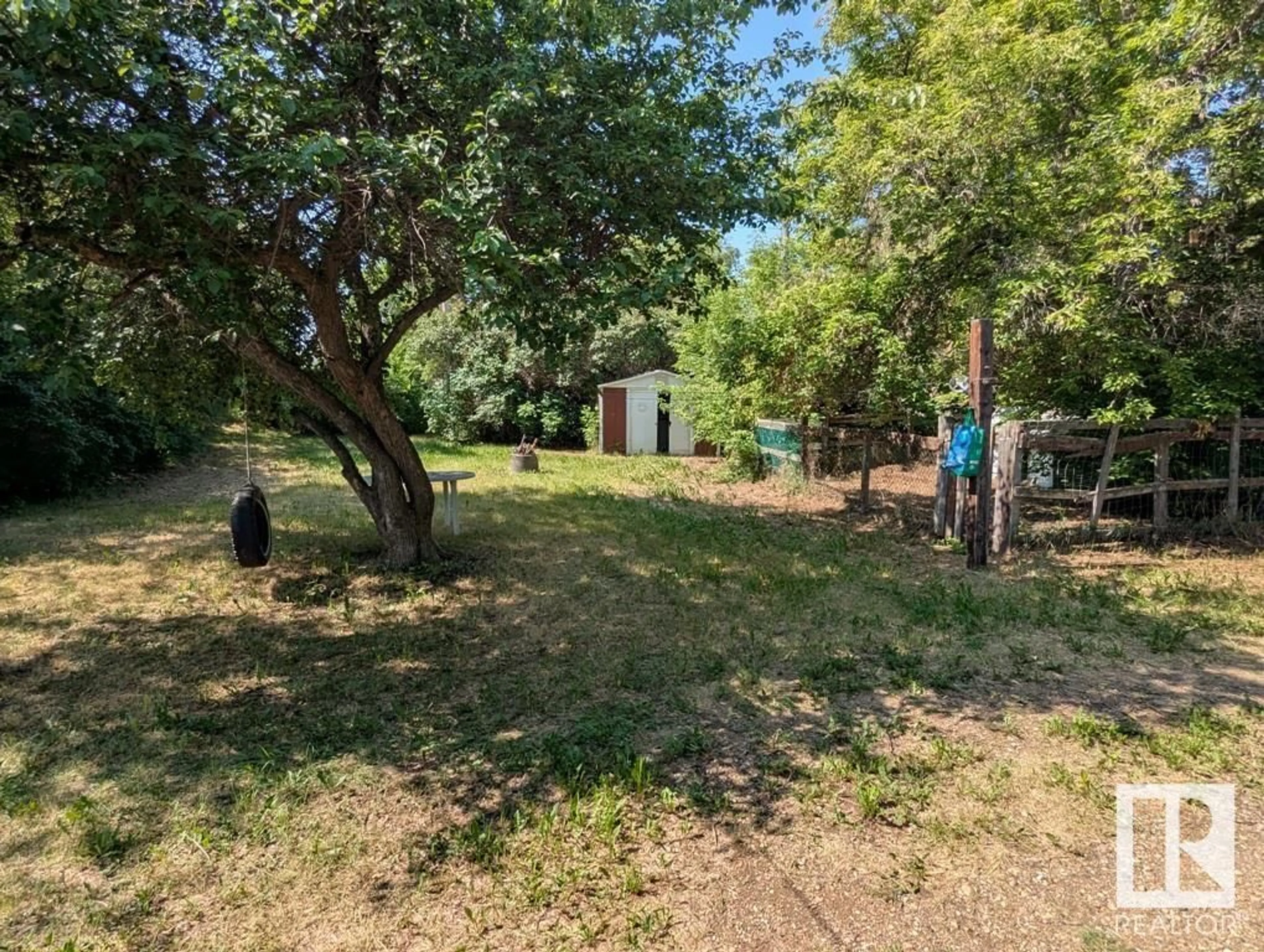 A pic from outside/outdoor area/front of a property/back of a property/a pic from drone, forest/trees view for 4927 55 AV, Ryley Alberta T0B4A0