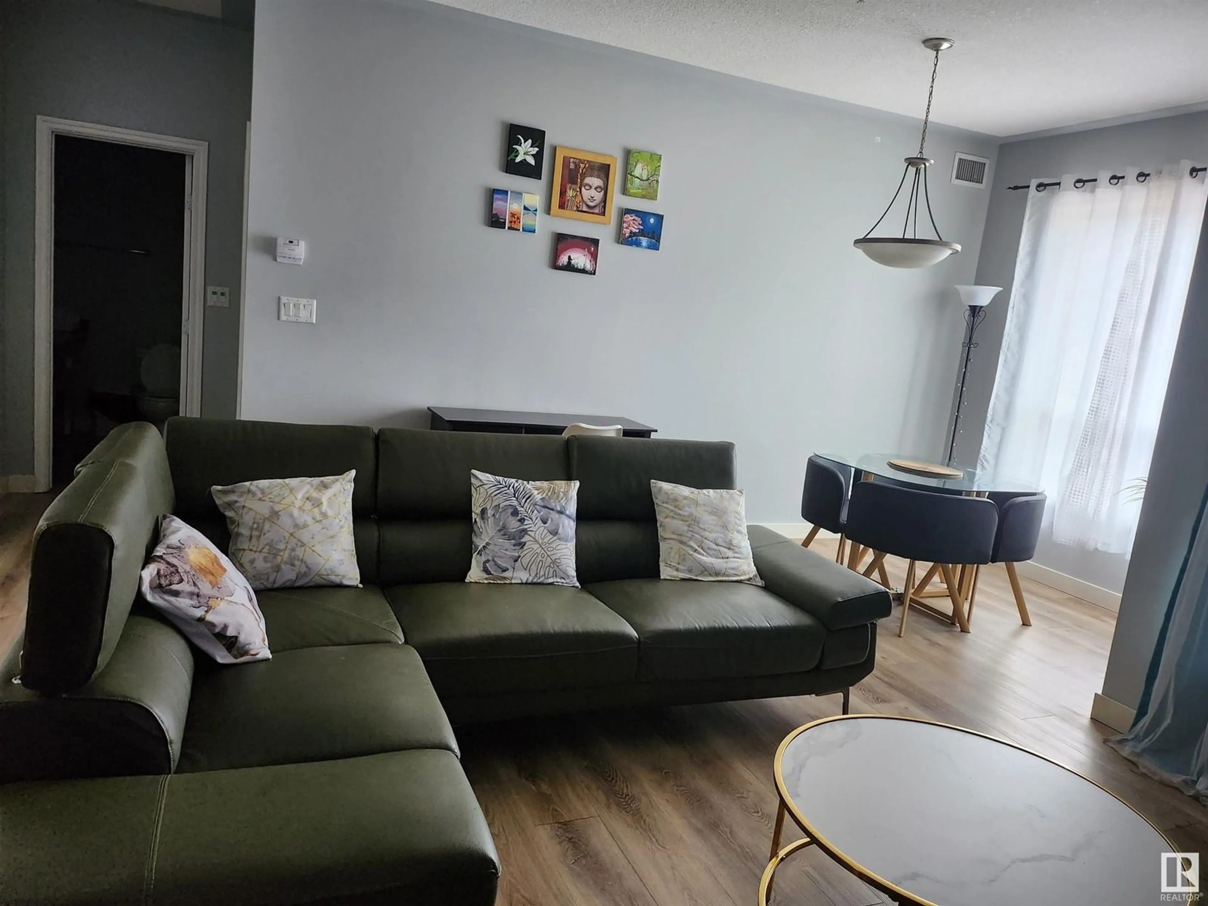 Living room with furniture, wood/laminate floor for #206 - 10606 102 AV, Edmonton Alberta T5J5E9