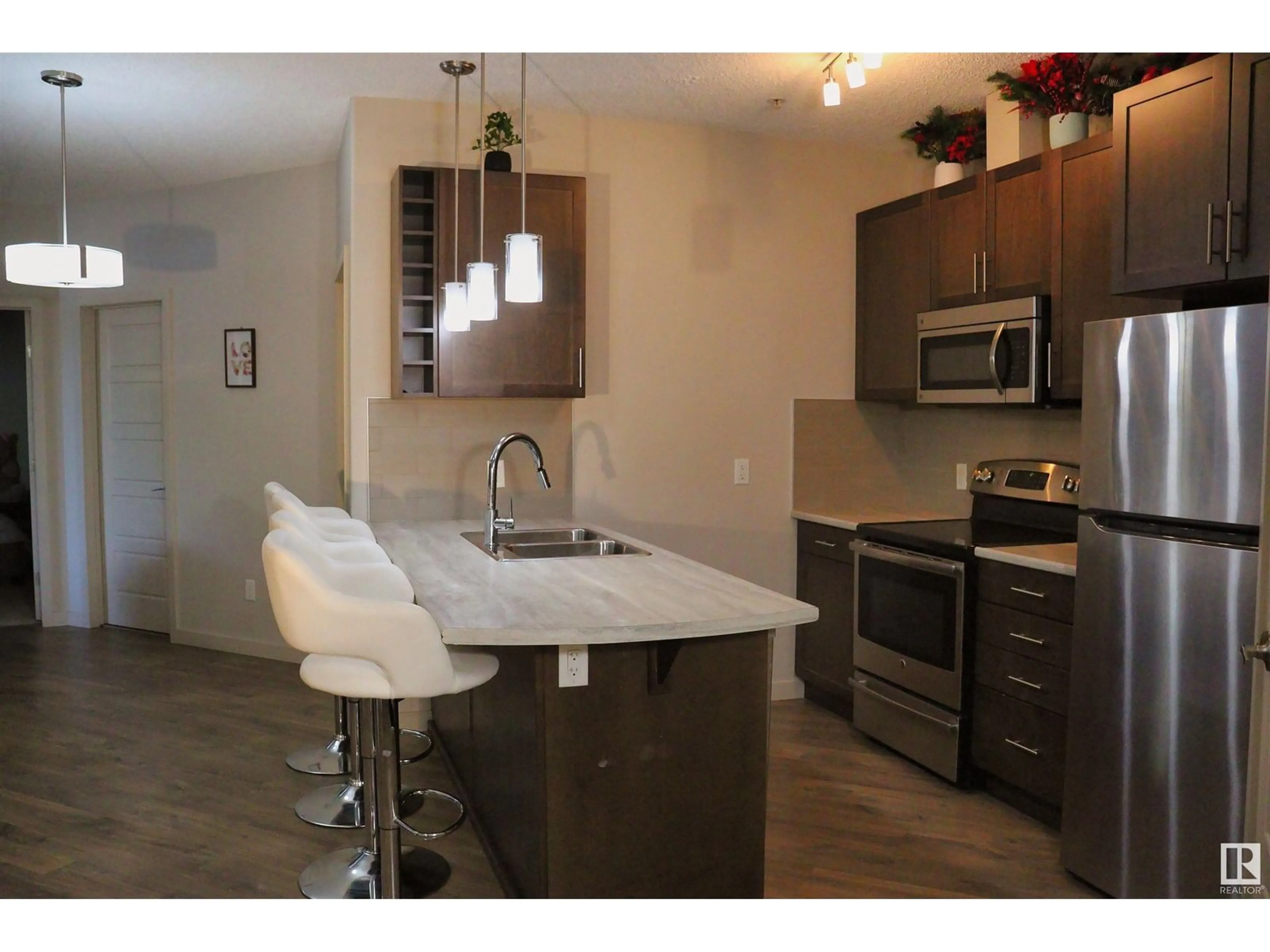 Open concept kitchen, wood/laminate floor for 1144 - 110 ADAMSON DR, Edmonton Alberta T6W2X7