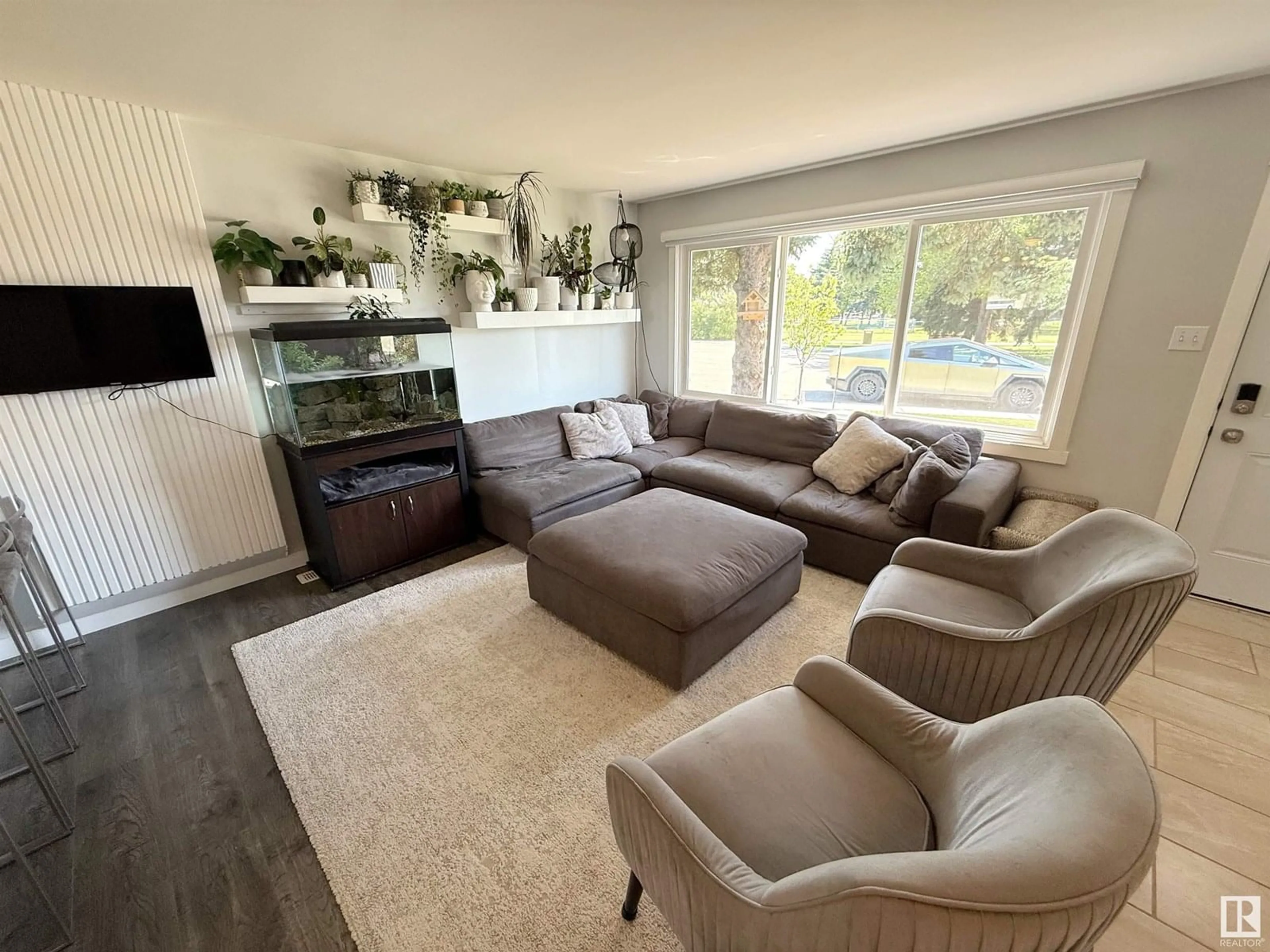 Living room with furniture, wood/laminate floor for 13312 103 ST, Edmonton Alberta T5E4M5