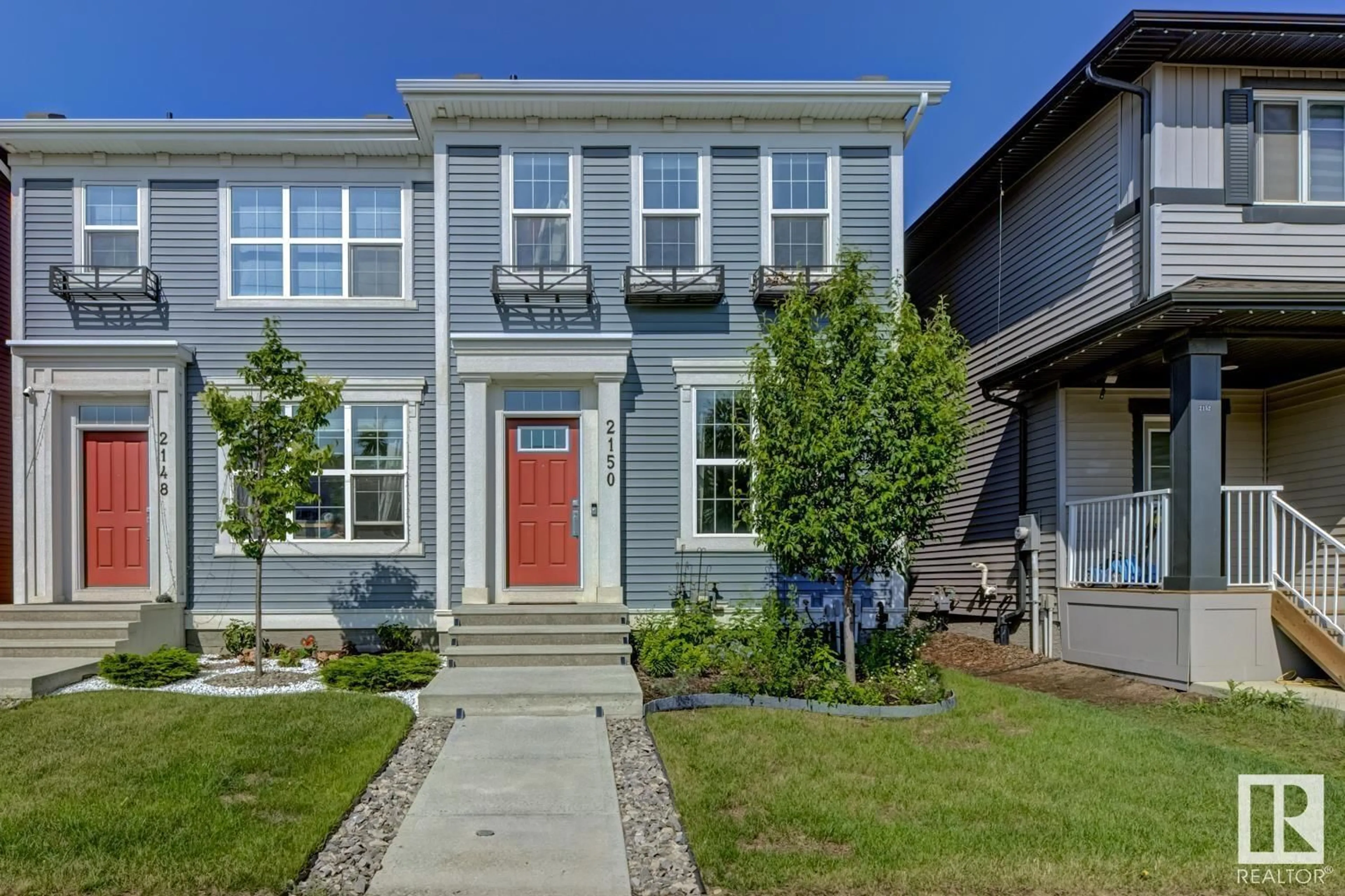 Home with vinyl exterior material, street for 2150 MAPLE RD, Edmonton Alberta T6T2L4