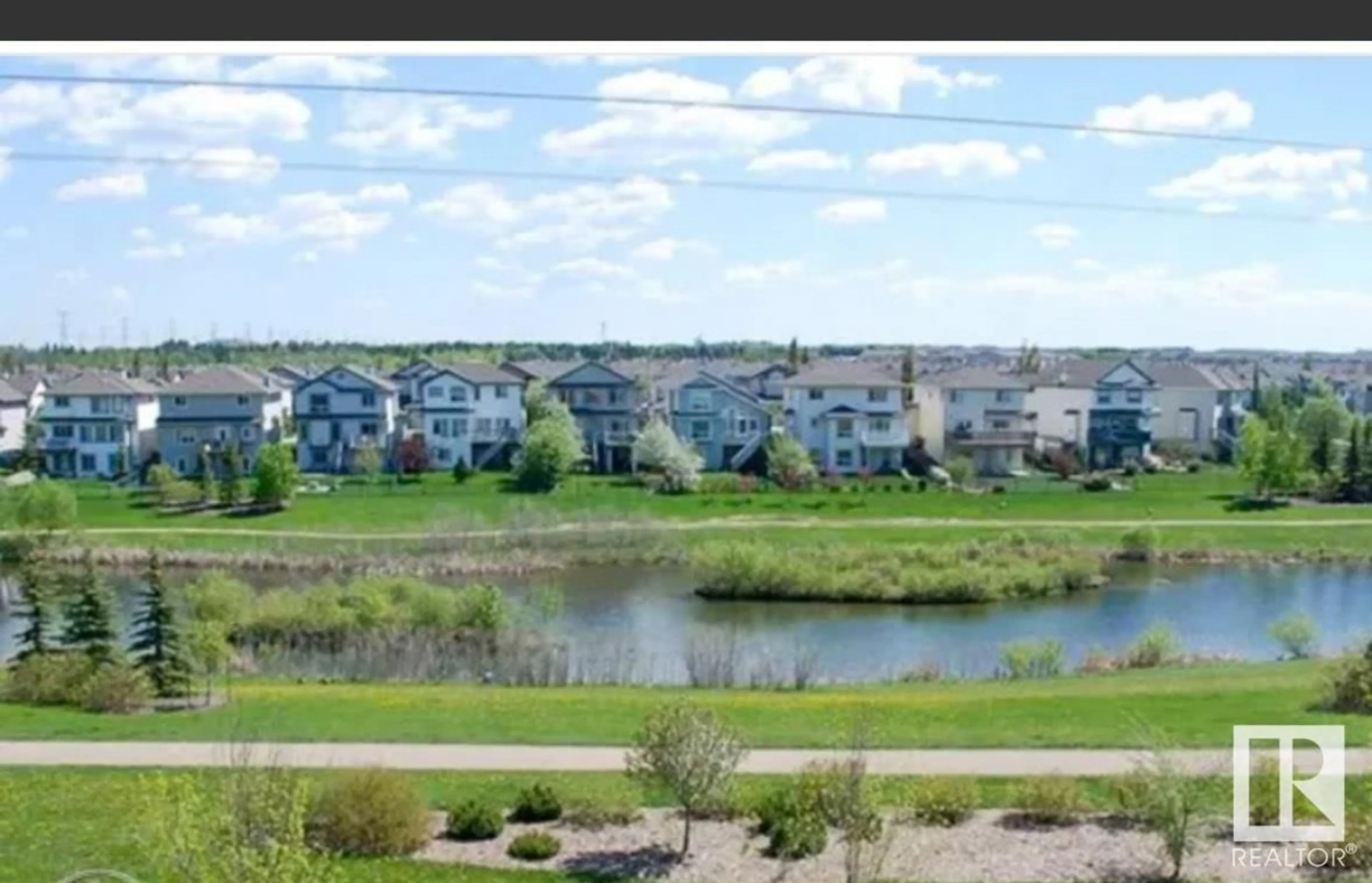 A pic from outside/outdoor area/front of a property/back of a property/a pic from drone, water/lake/river/ocean view for 245 - 211 EDWARDS DR, Edmonton Alberta T6X1J9