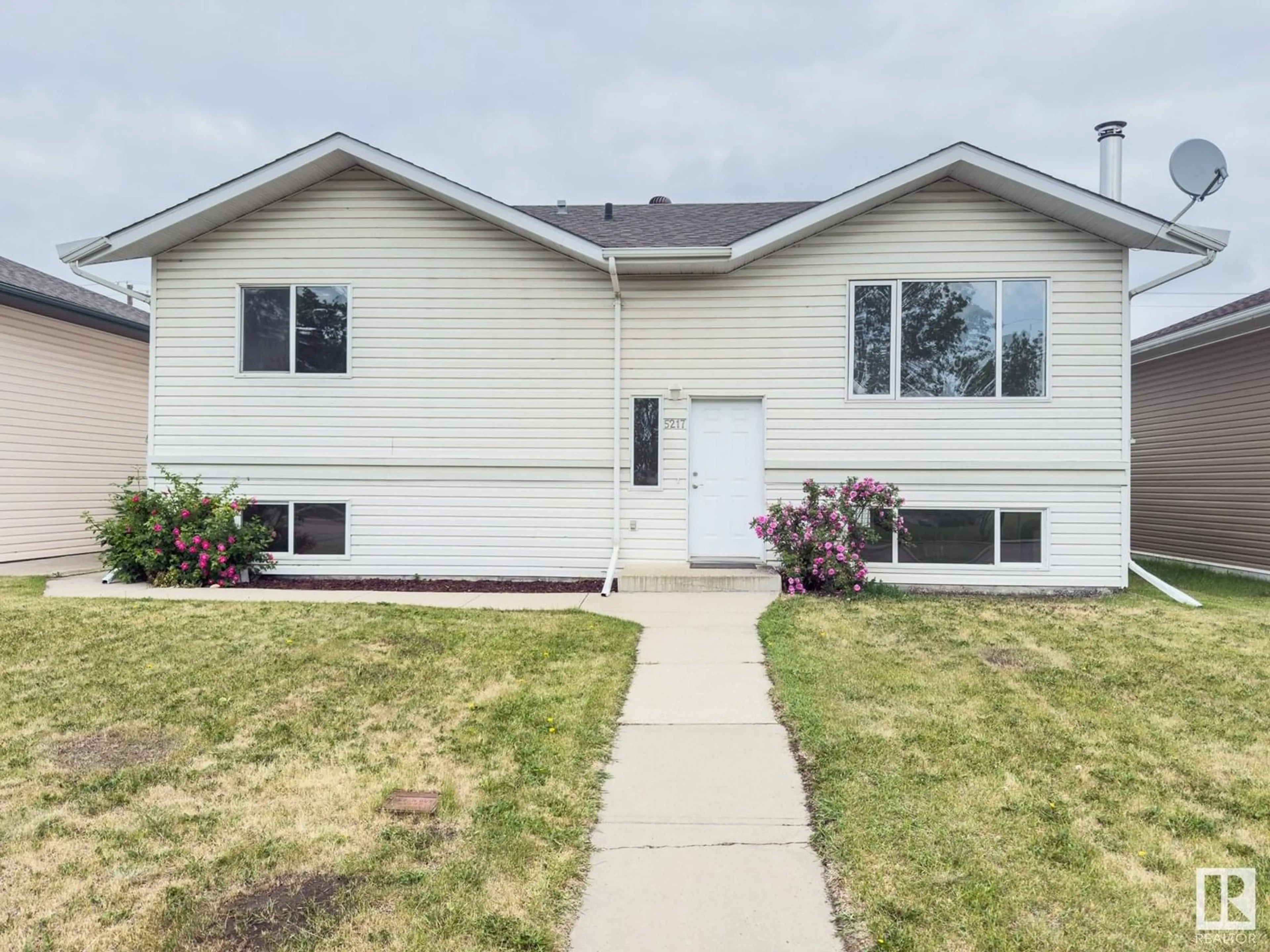 Home with vinyl exterior material, street for 5217 53 AV, Bonnyville Town Alberta T9N2B2