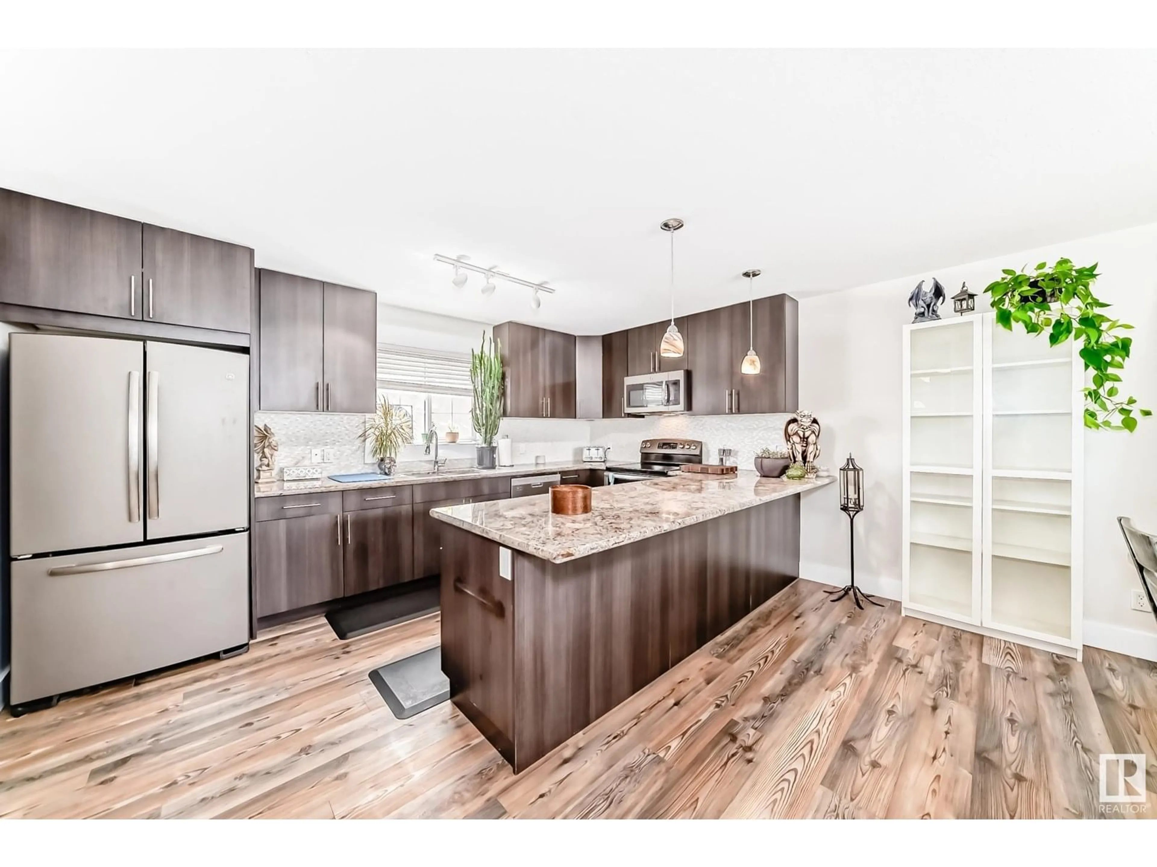 Open concept kitchen, wood/laminate floor for 9211 123 AV, Edmonton Alberta T5G0R1