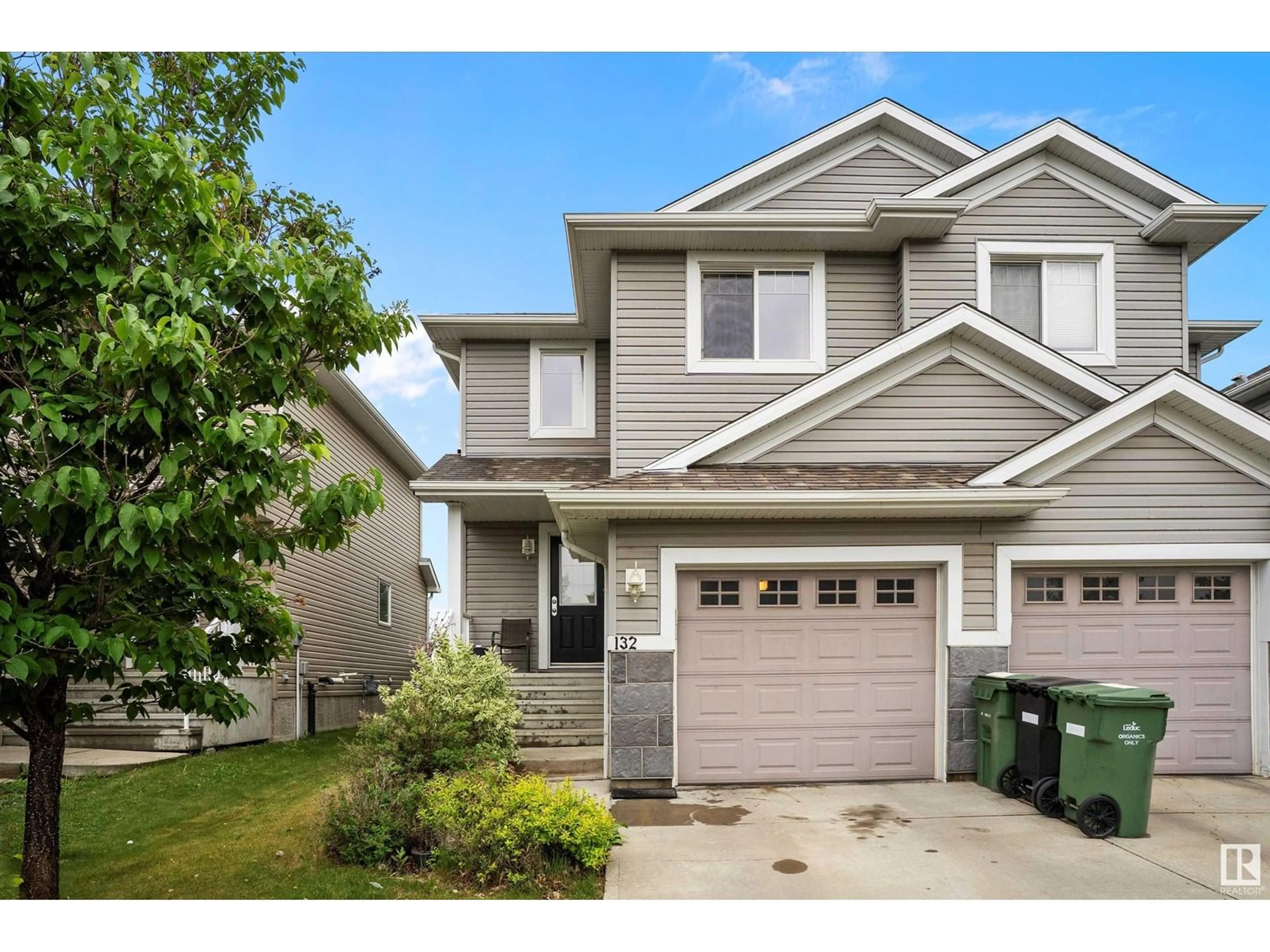 Home with vinyl exterior material, street for 132 KEYSTONE CR, Leduc Alberta T9E0M6