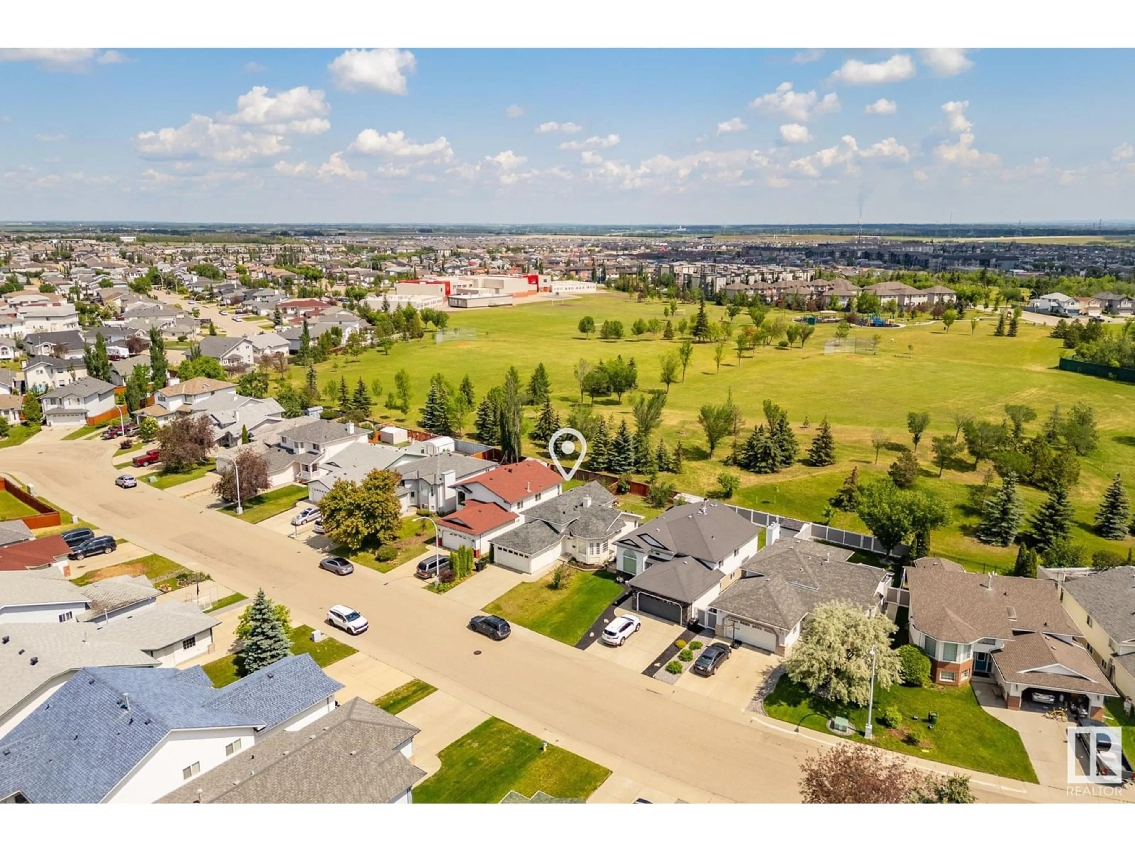 A pic from outside/outdoor area/front of a property/back of a property/a pic from drone, unknown for 129 HOLLICK-KENYON WY, Edmonton Alberta T5Y2V7