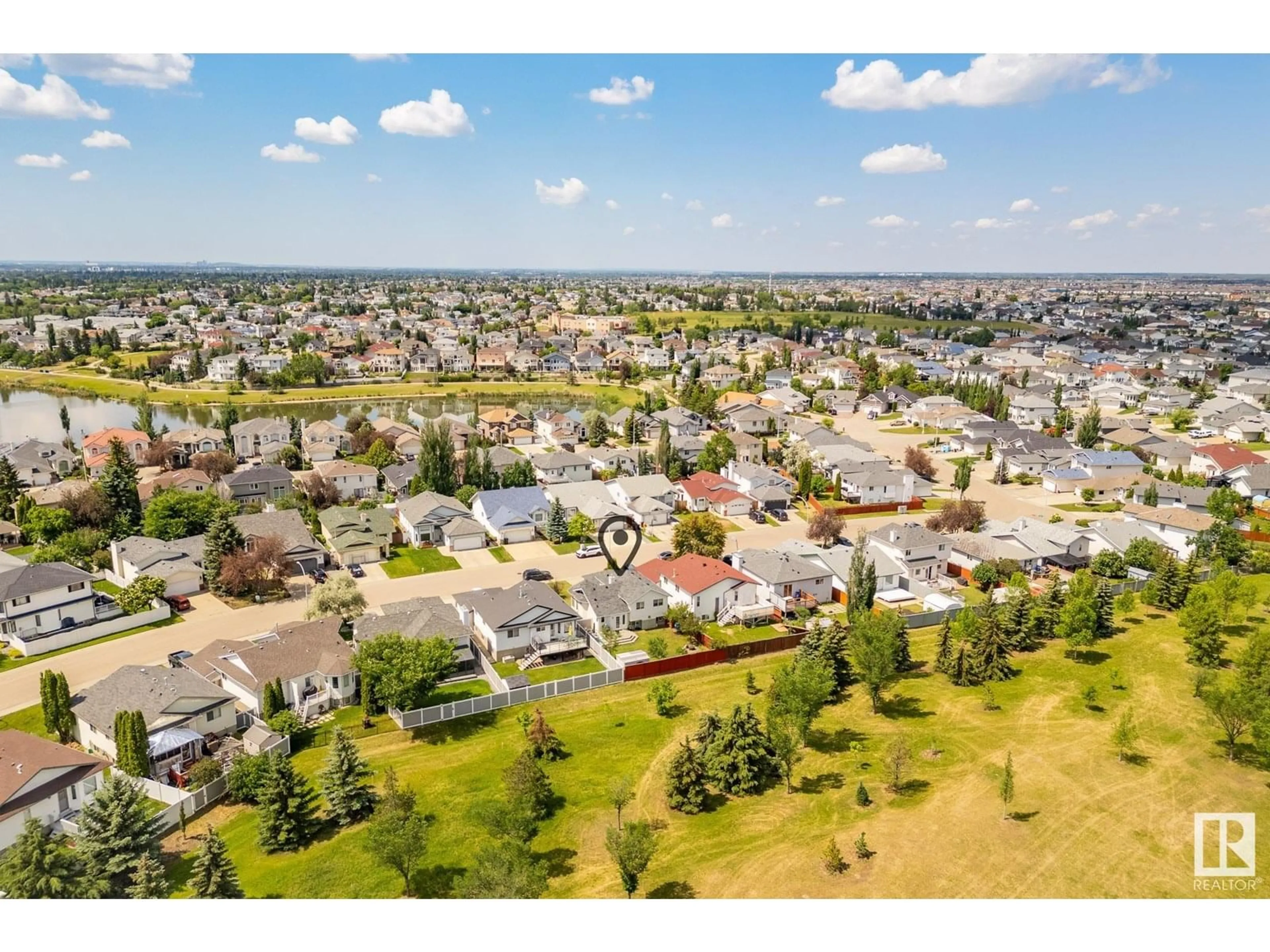A pic from outside/outdoor area/front of a property/back of a property/a pic from drone, unknown for 129 HOLLICK-KENYON WY, Edmonton Alberta T5Y2V7