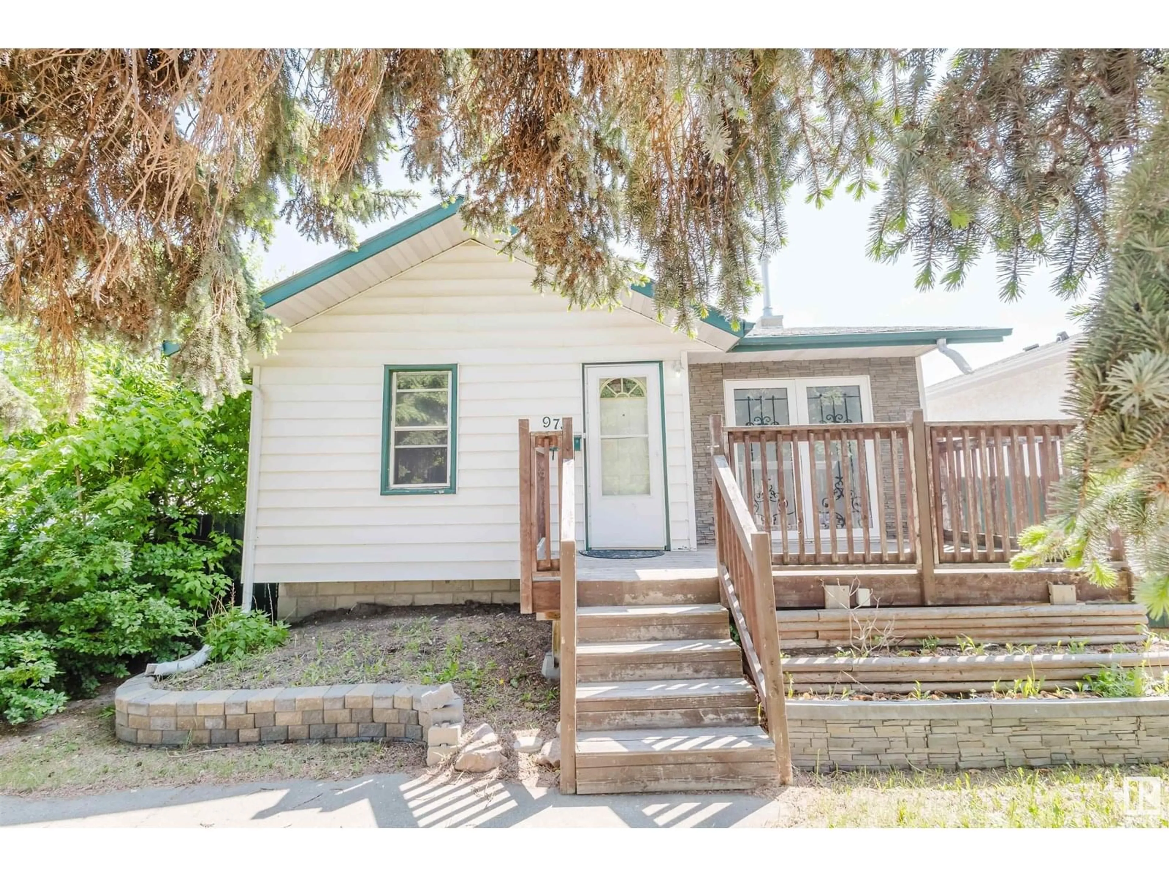 Home with vinyl exterior material, street for NW - 9731 162 ST, Edmonton Alberta T5P3L1